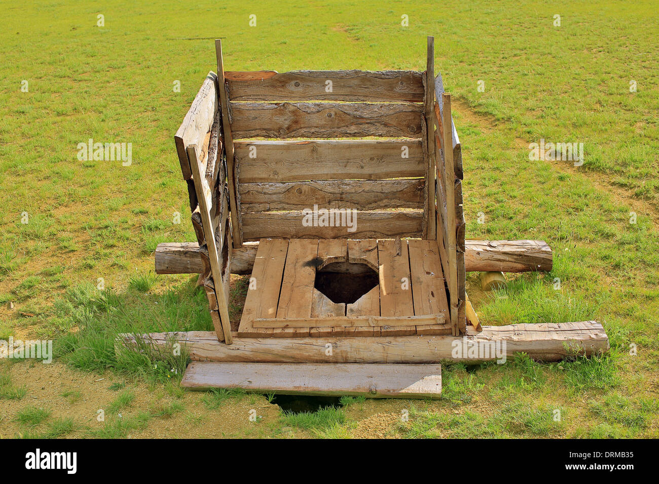 Mongolo squat in legno WC Foto Stock