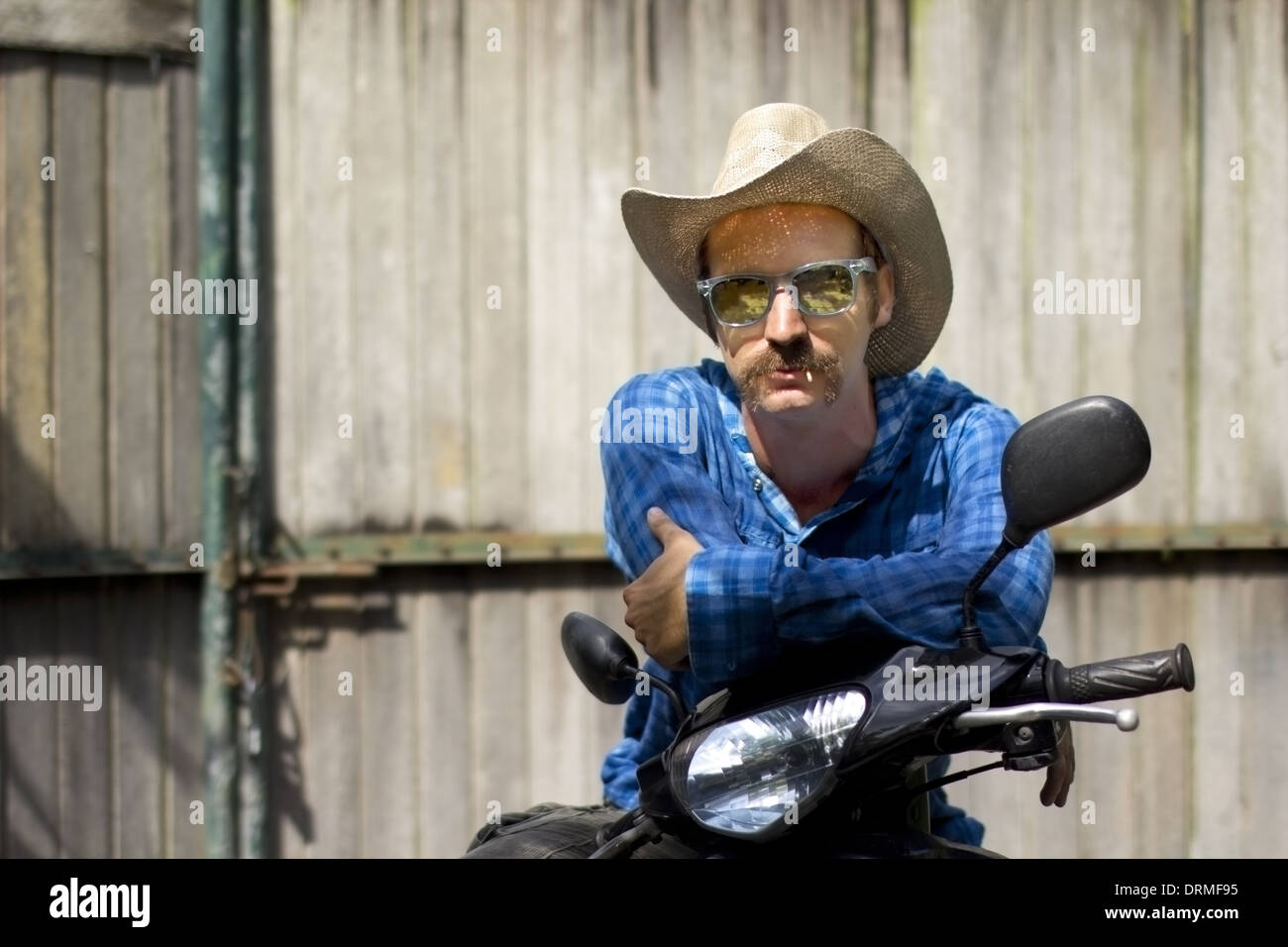 Cowboy in moto Foto Stock