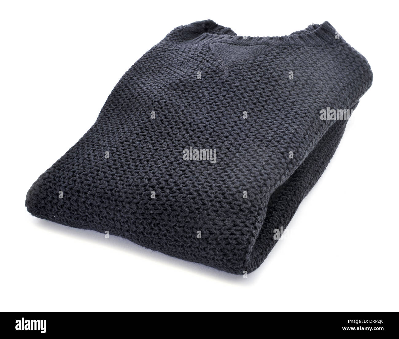 Un maglione nero piegato su sfondo bianco Foto stock - Alamy