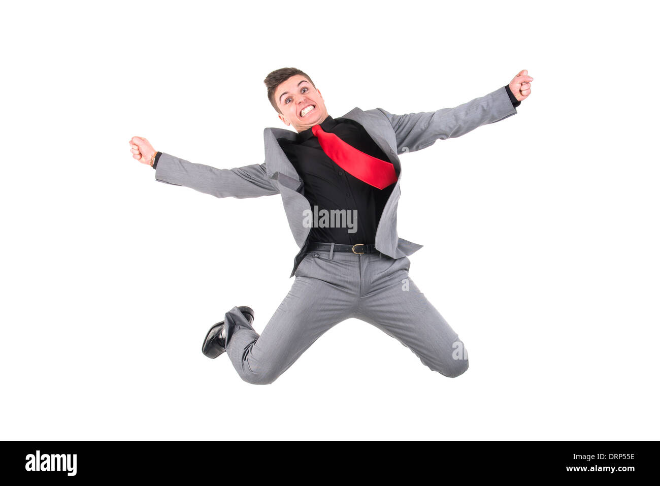 Happy businessman jumping alto isolato in bianco Foto Stock