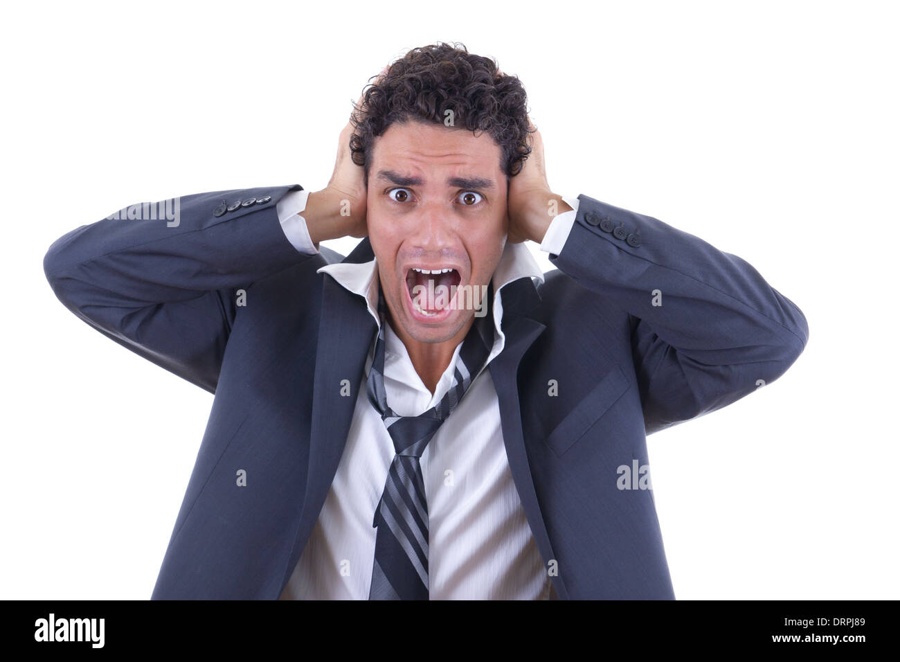 Uomo in business suit tenendo la sua testa e urlando Foto Stock