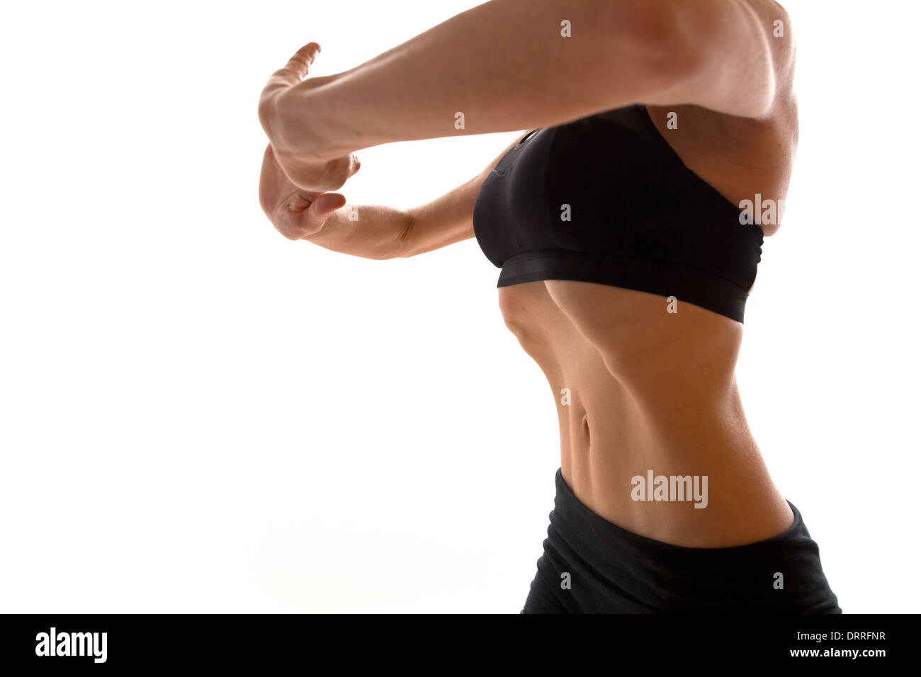 Donna hypopressive facendo esercizi addominali Foto Stock