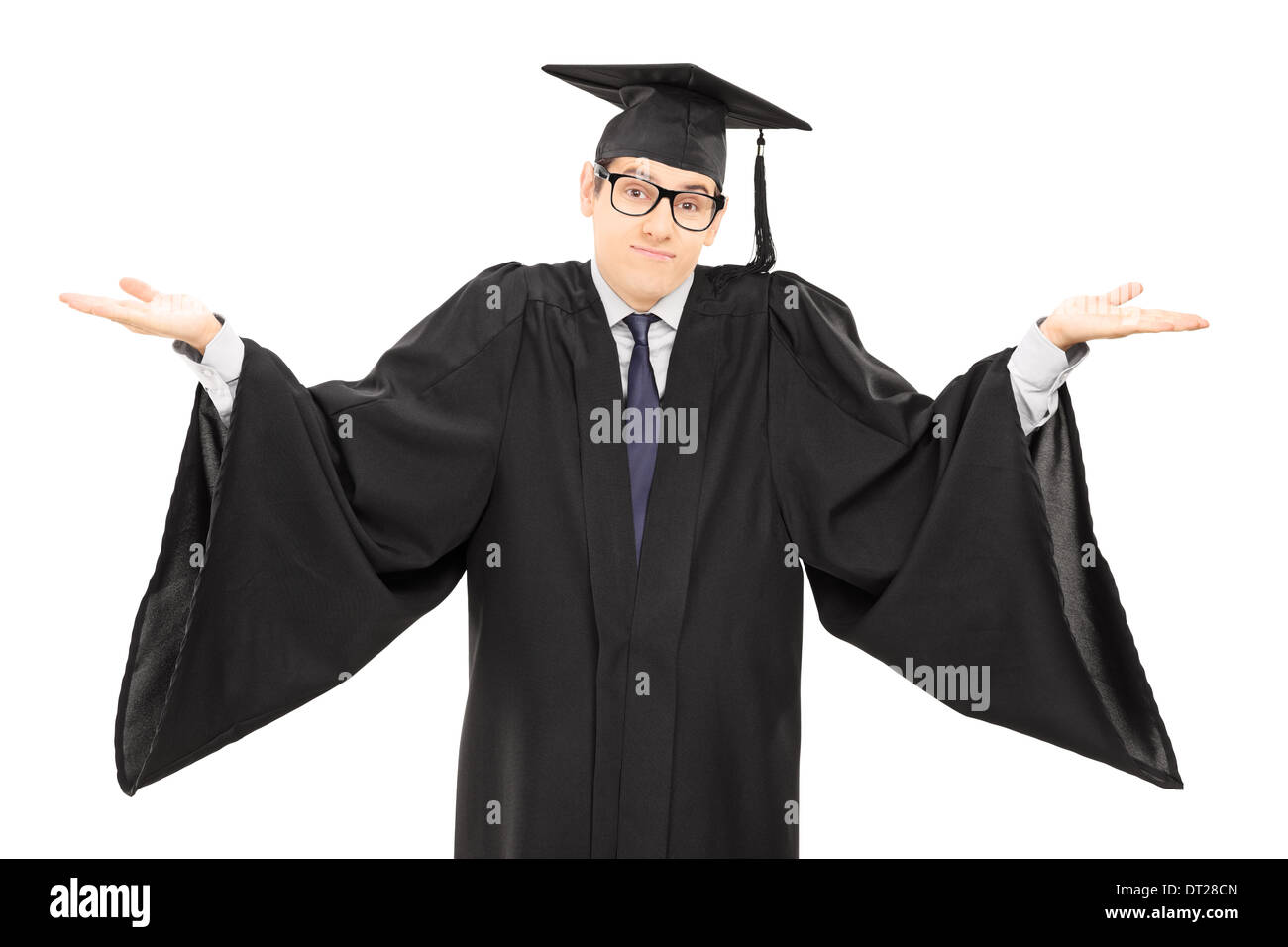 Studente incerto in abito di graduazione gesti con le mani Foto Stock