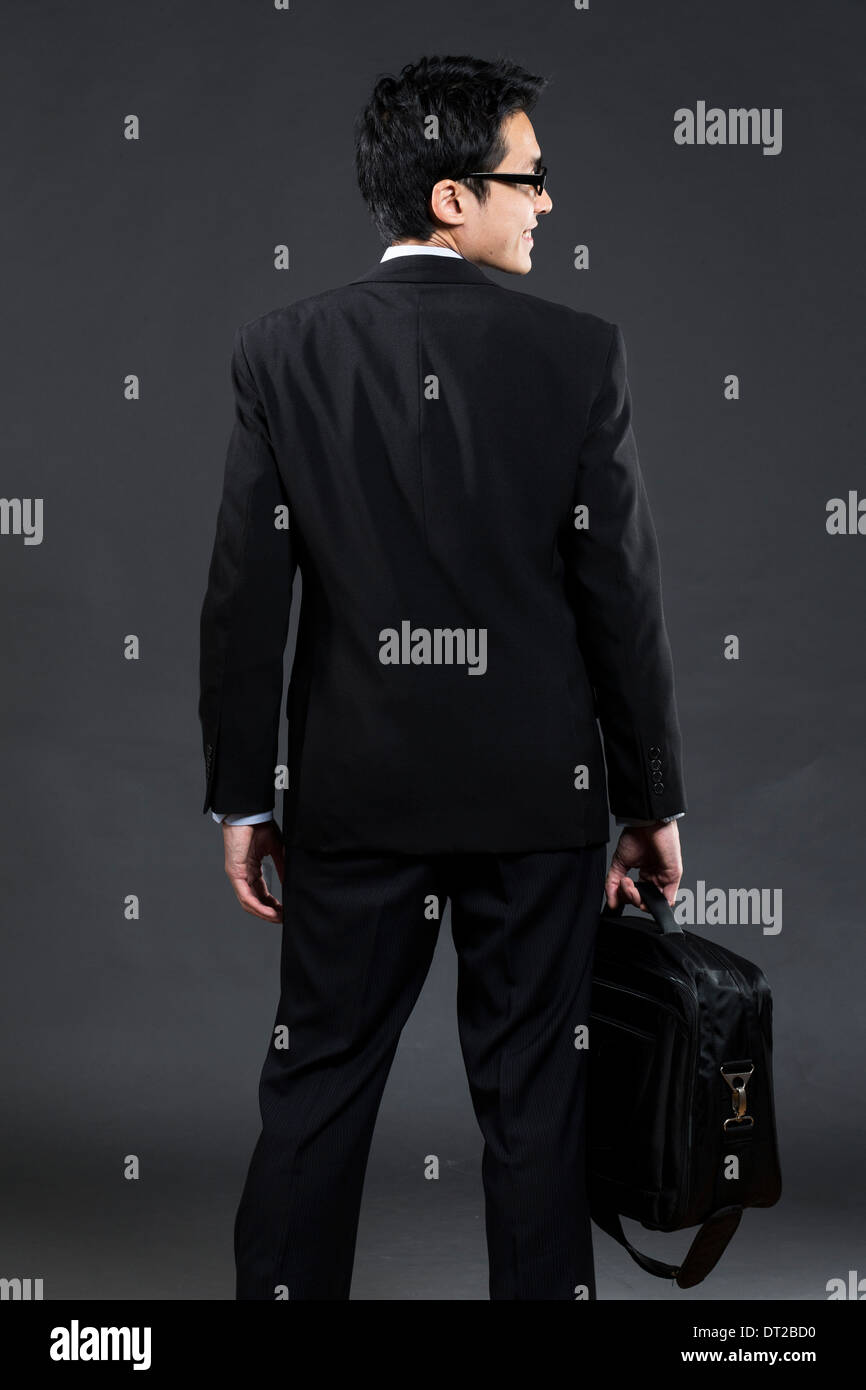 Vista posteriore di un cinese business man. Foto Stock