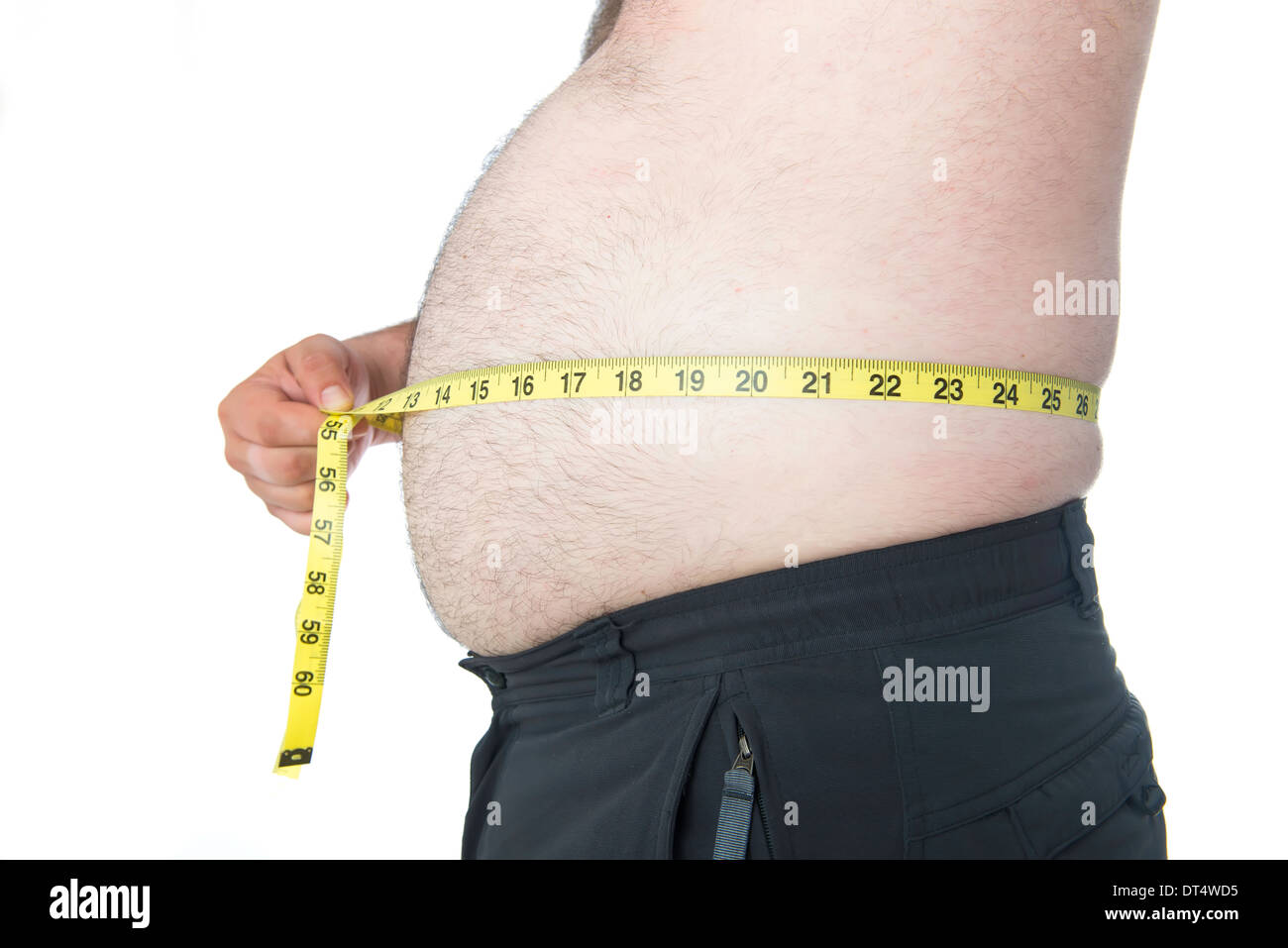 Fat Man con una grande pancia con un nastro di misurazione Foto Stock