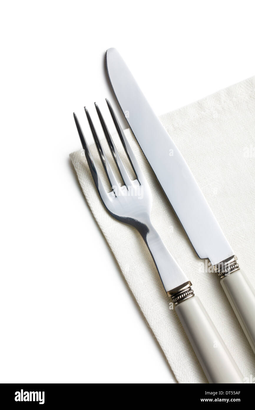 La forchetta e coltello sul tovagliolo bianco Foto Stock