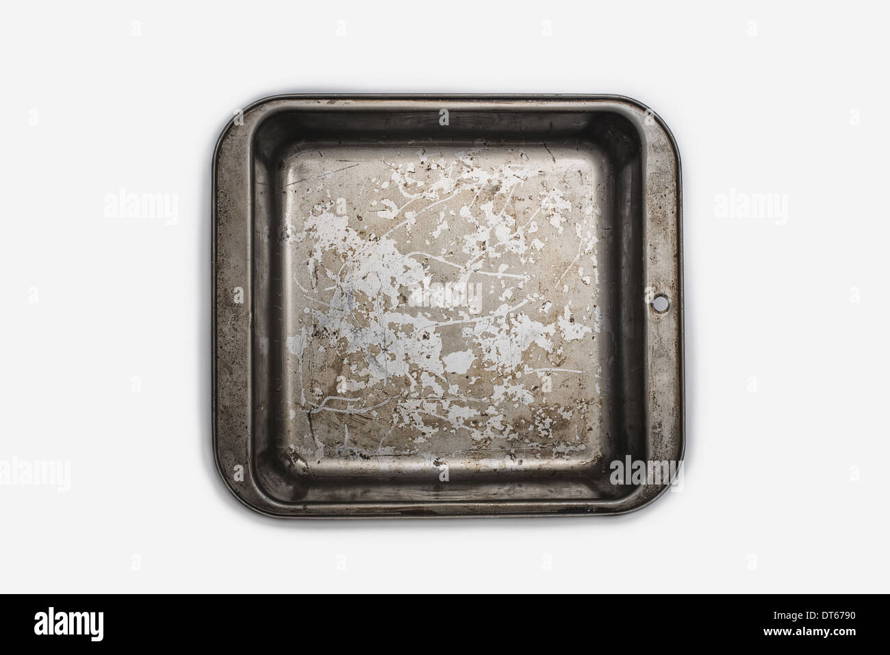 Un ben utilizzati, condito vassoio da forno. Pentole. Un quadrato lievito teglia 9 pollici quadrati. Pan. Foto Stock