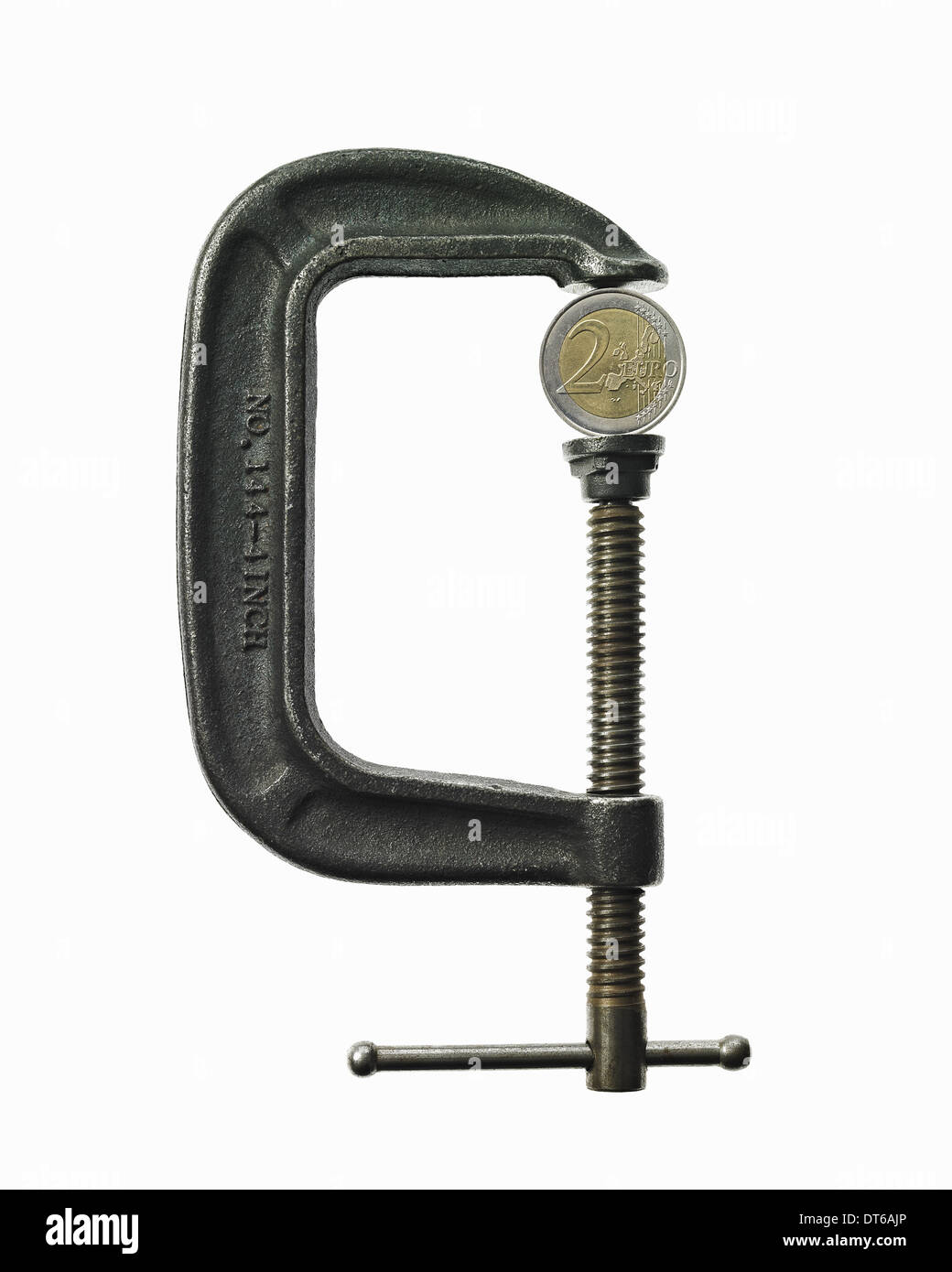 Una moneta in una morsa. Ti senti, economico squeeze. Foto Stock