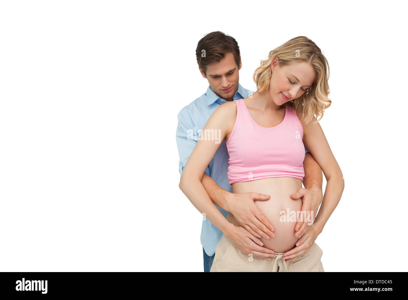 Donne incinte genitori felici tenendo le madri baby bump Foto Stock