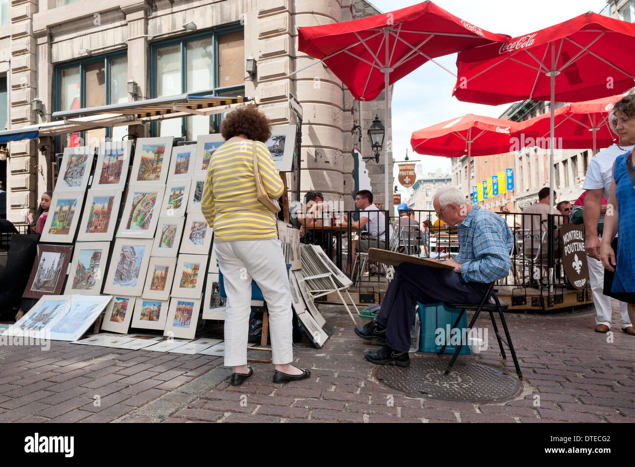 Artista al lavoro nella vecchia Montreal, provincia del Québec in Canada. Foto Stock