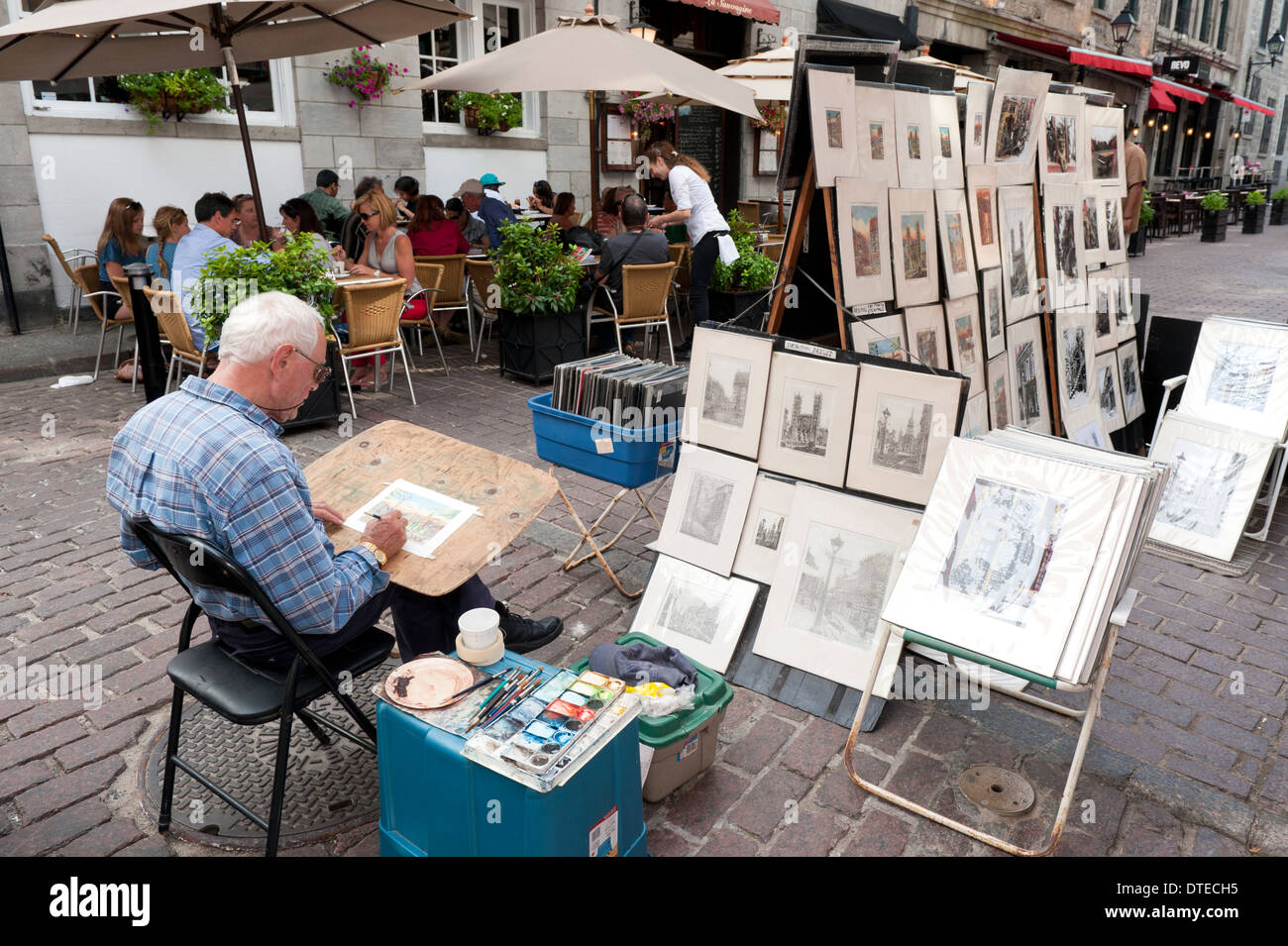 Artista al lavoro nella vecchia Montreal, provincia del Québec in Canada. Foto Stock