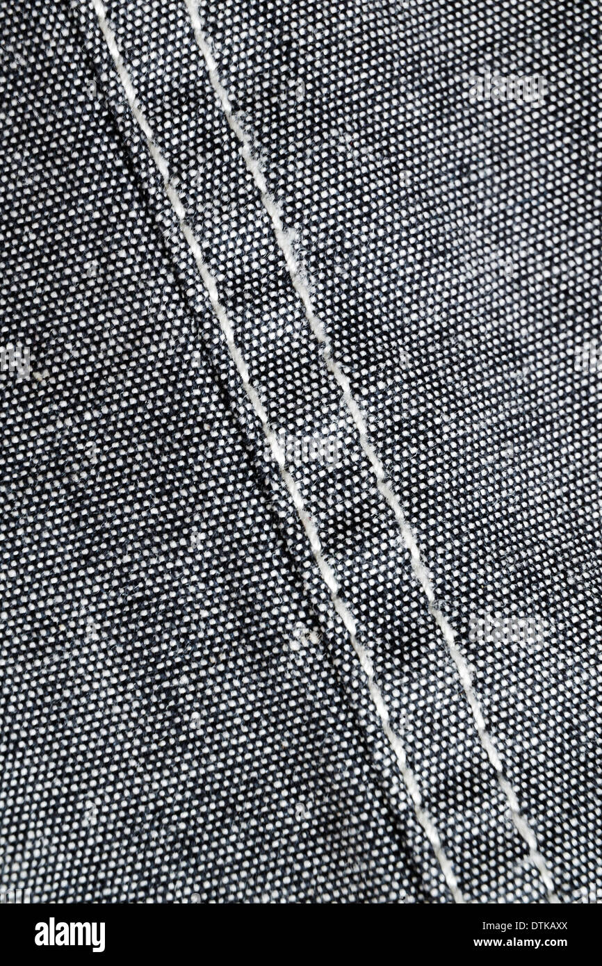 Grigio materiale di cotone con il parallelo di cuciture diagonali Foto Stock
