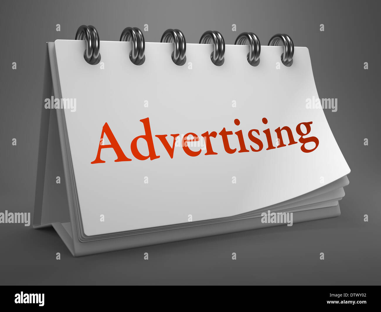 Pubblicità - Parola rosso su bianco calendario desktop isolati su sfondo grigio. Foto Stock