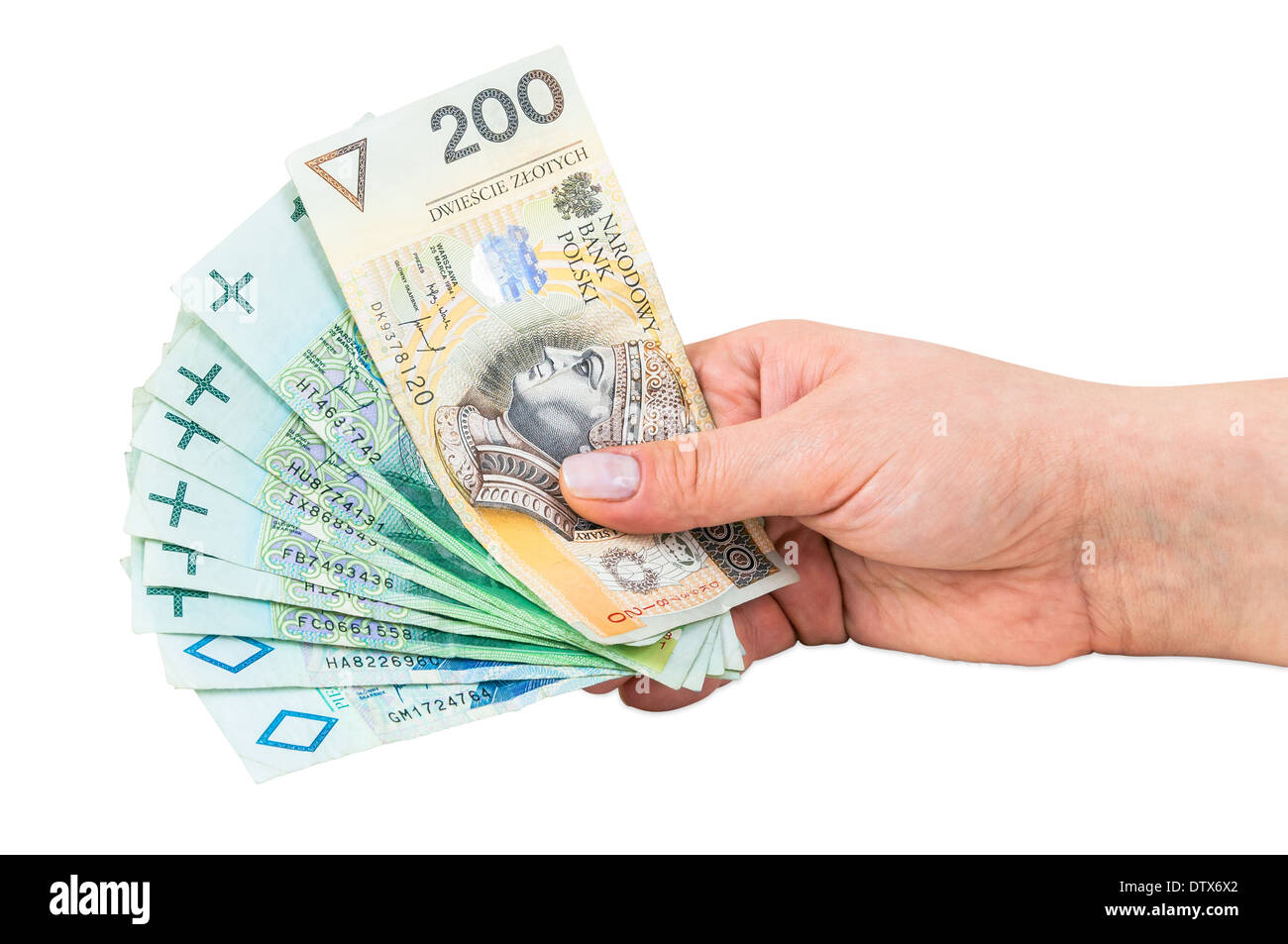 Mano che trattiene le banconote in polacco isolato su sfondo bianco con tracciato di ritaglio Foto Stock