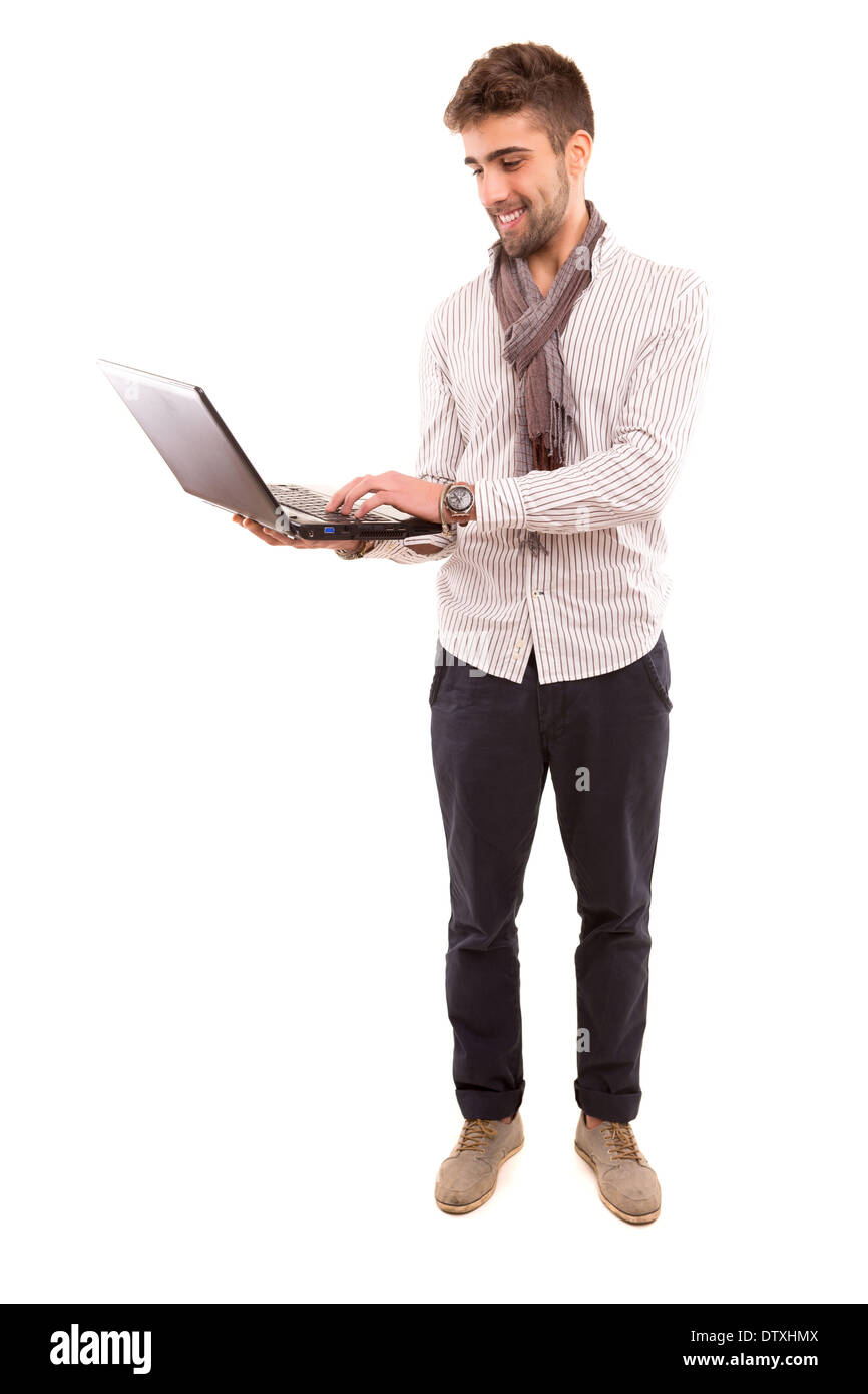 Giovane uomo bello lavorare con il computer portatile Foto Stock