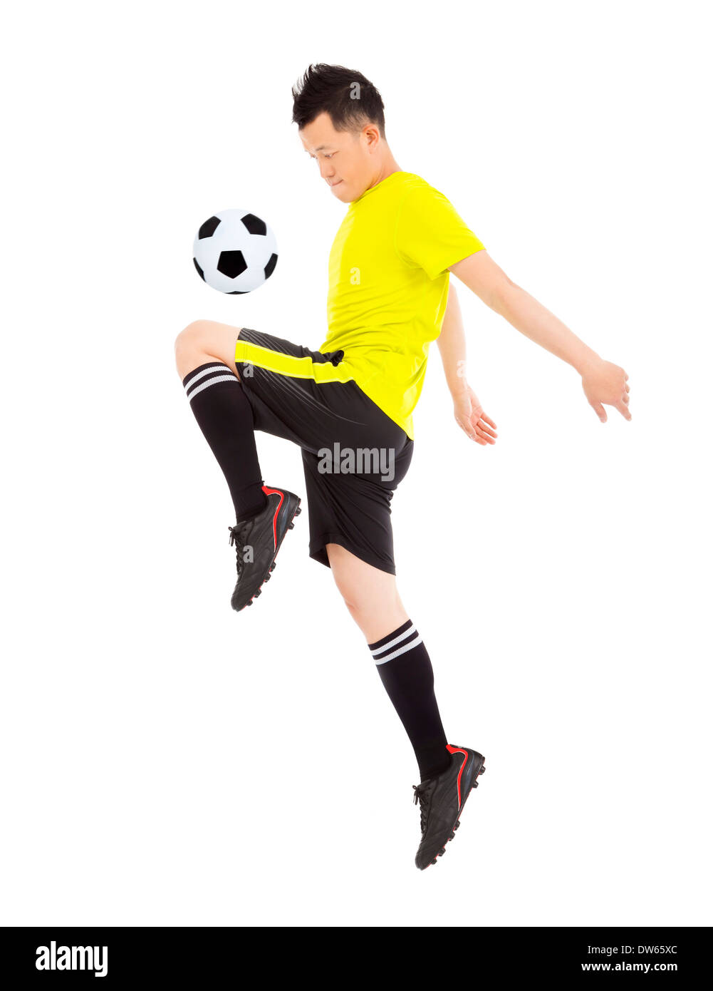 Asian soccer player jumping per fermare la palla su bianco Foto Stock Asian soccer player jumping per fermare la palla su bianco Foto Stock