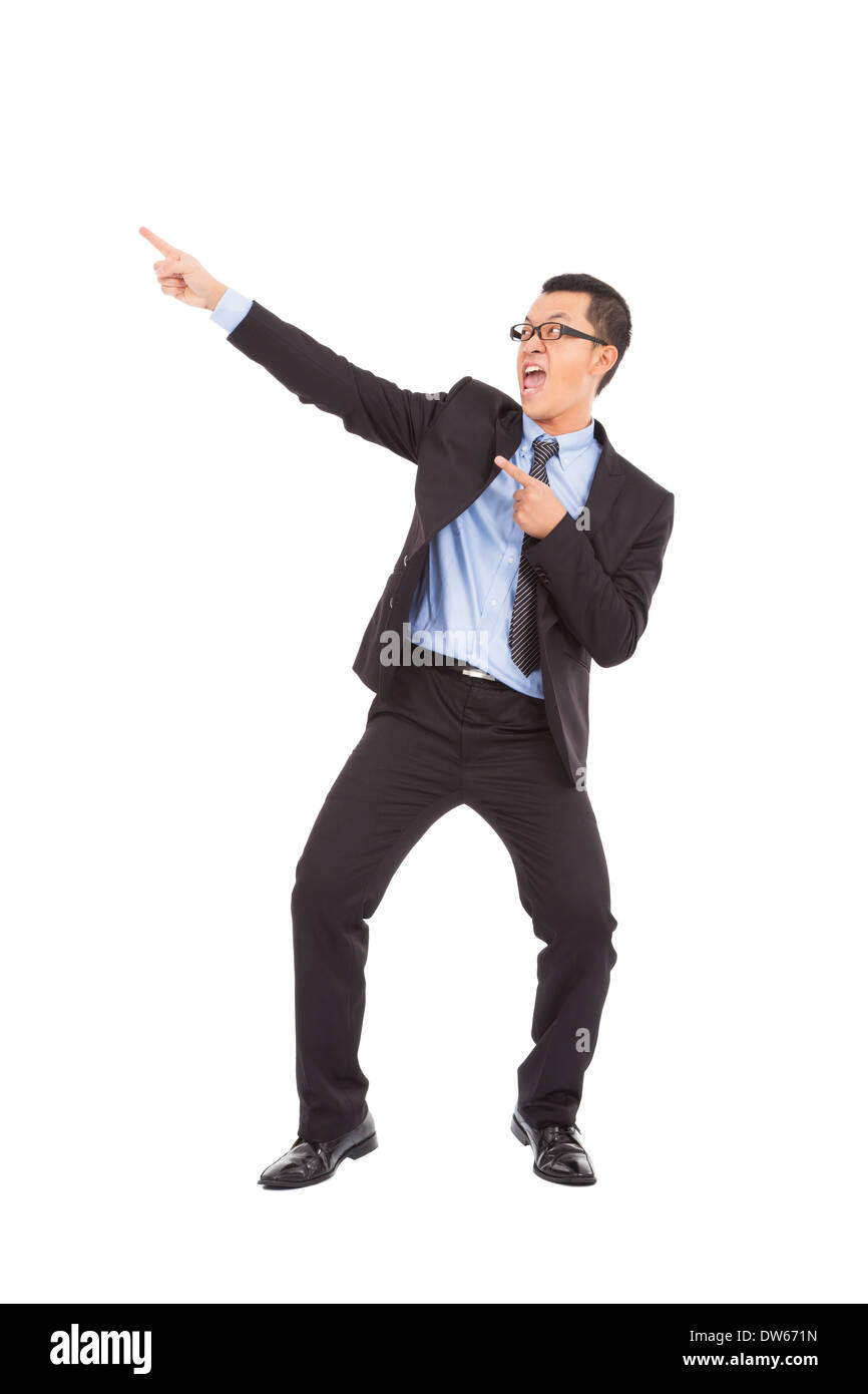 Happy businessman dancing uno strano gesto in studio Foto Stock