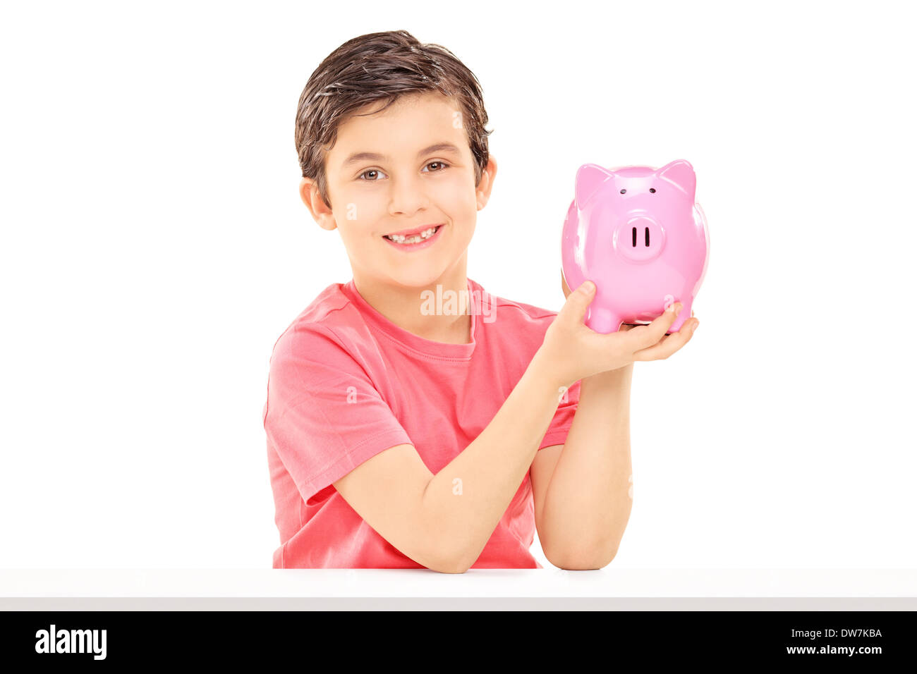 Little Boy tenendo un piggybank Foto Stock