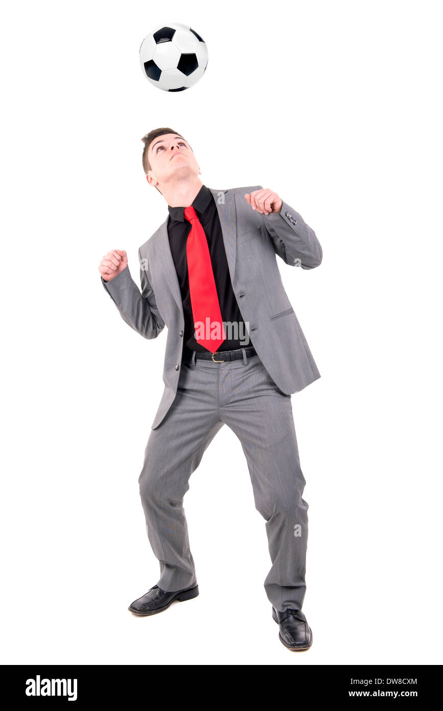 Imprenditore che giocano a calcio isolati in bianco Foto Stock