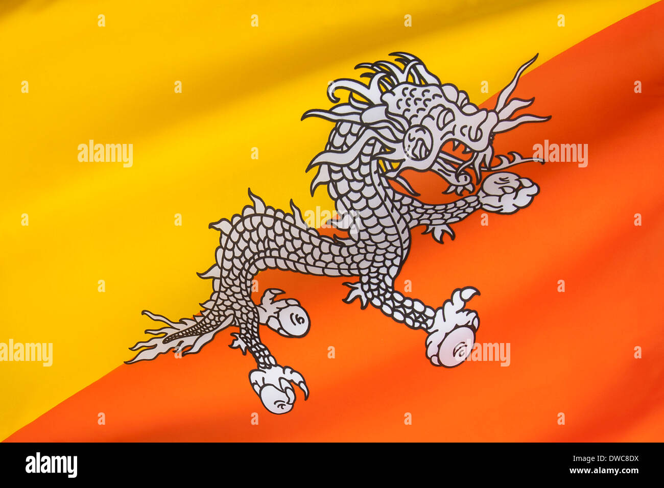 La bandiera nazionale del Regno del Bhutan Foto Stock