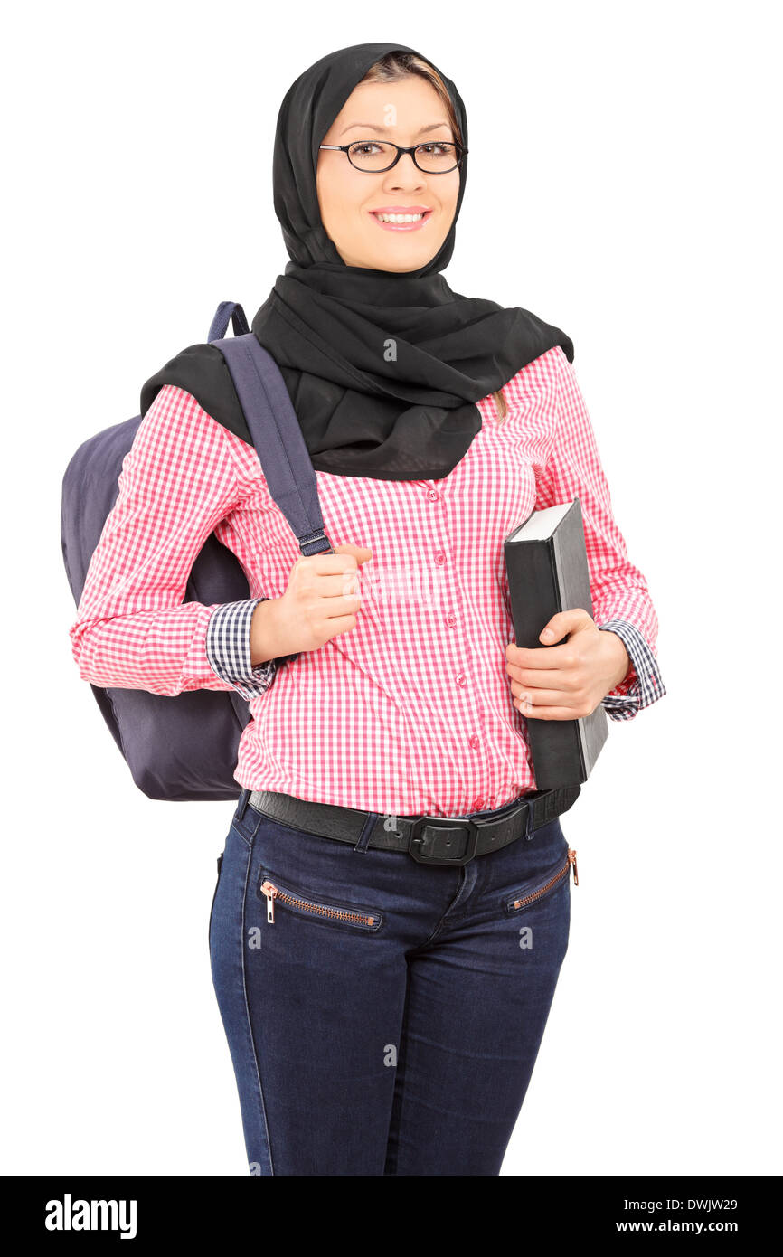 Studentessa con il tradizionale velo islamico azienda prenota Foto Stock