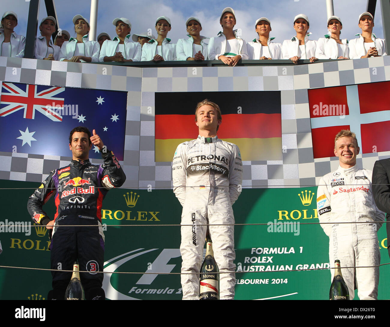 Melbourne, Australia. Il 16 marzo 2014. top tre sul podio (L-R) Daniel Ricciardo (AUS) #3, Infiniti Red Bull Racing (2nd), Nico Rosberg (GER) #6, Mercedes AMG Petronas F1 Team (vincitore di gara) e Kevin Magnussen (DEN) #20, la McLaren Mercedes (3rd) - Formula1 nel Campionato del Mondo 2014 - Round 01 a Melbourne Albert Park di Melbourne, Australia, domenica 16 marzo 2014 Credit: dpa picture alliance/Alamy Live News Foto Stock