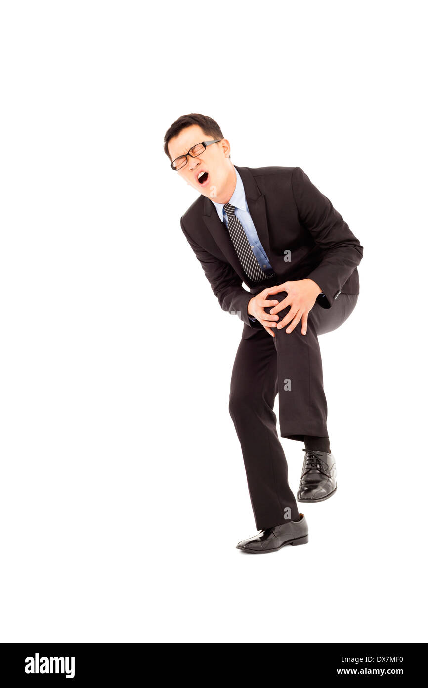 Imprenditore hanno il dolore al ginocchio e dolorosa espressione Foto Stock