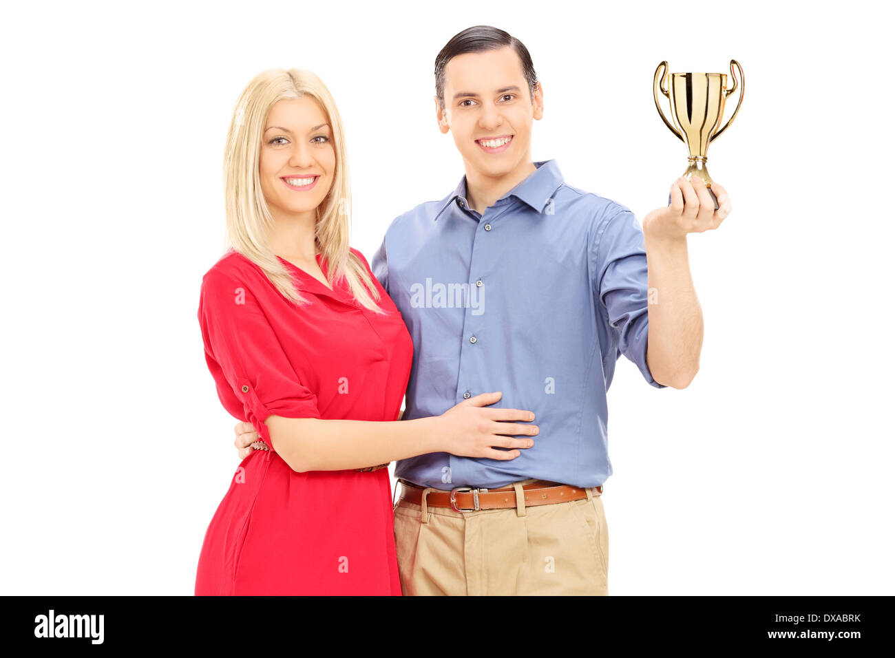 Coppia giovane tenendo un Gold Cup Foto Stock