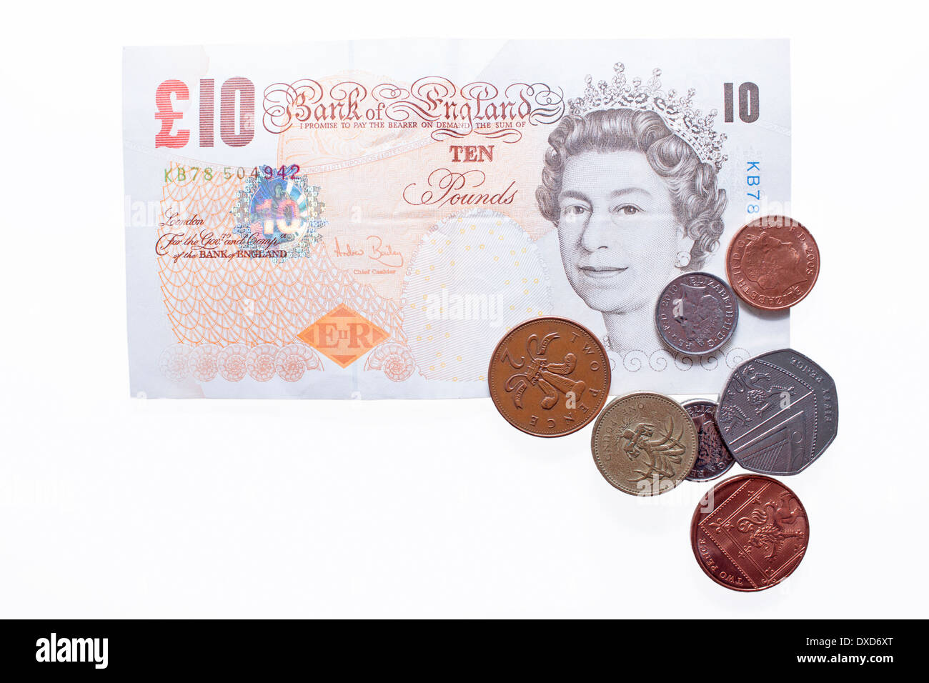 £10 nota con alcune monete. Foto Stock