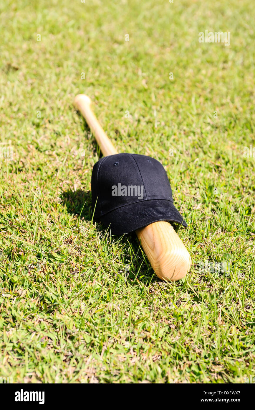 Concetto foto di una mazza da baseball e cappello nero Foto Stock