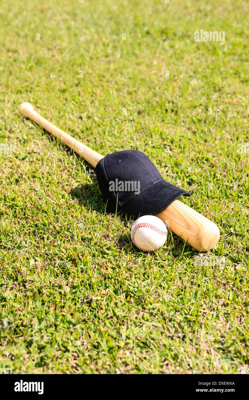 Concetto foto di una mazza da baseball palla e black hat Foto Stock