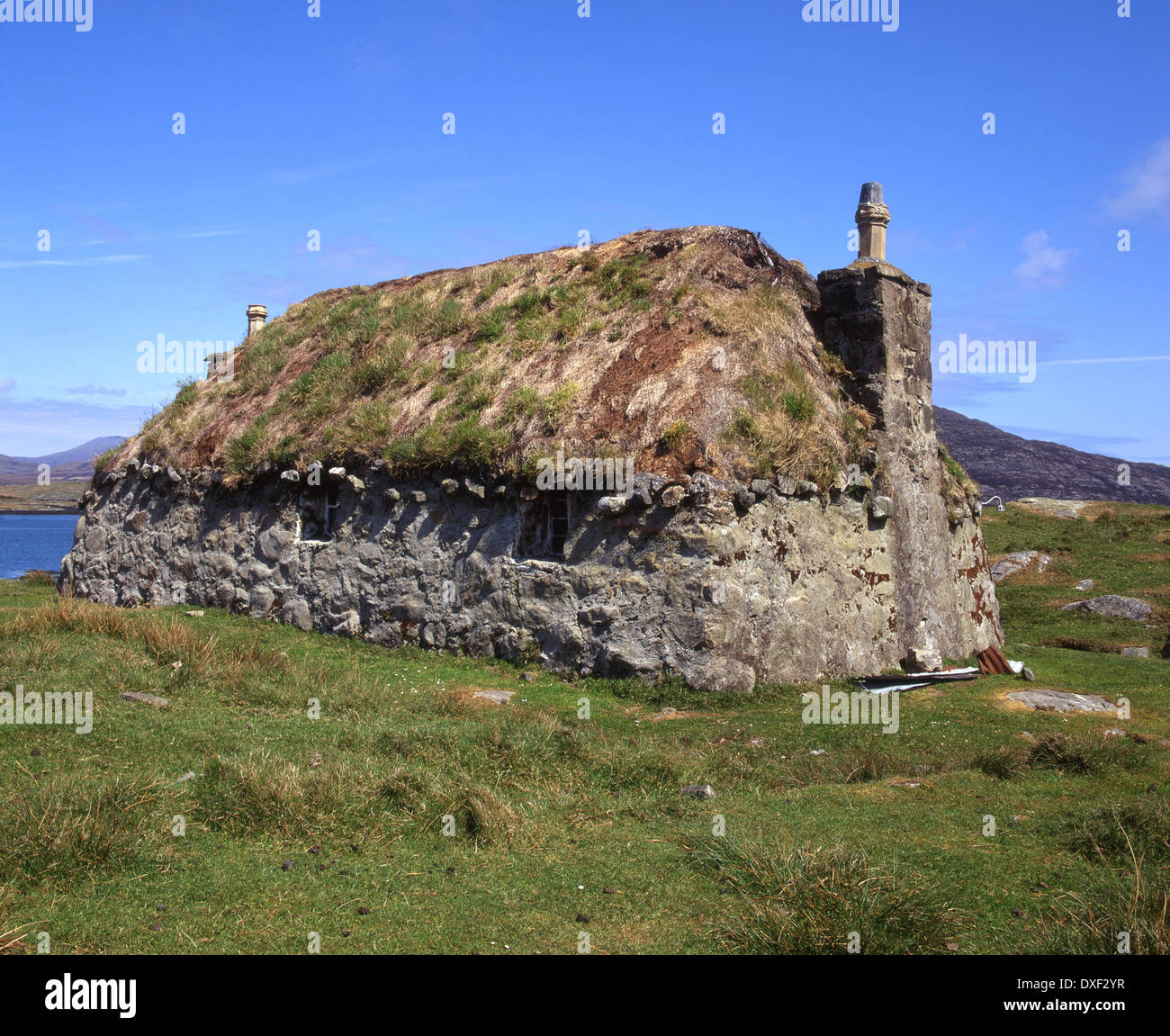 Con il tetto di paglia vecchia croft, Nord di Glendale, South Uist, Ebridi Esterne. Foto Stock