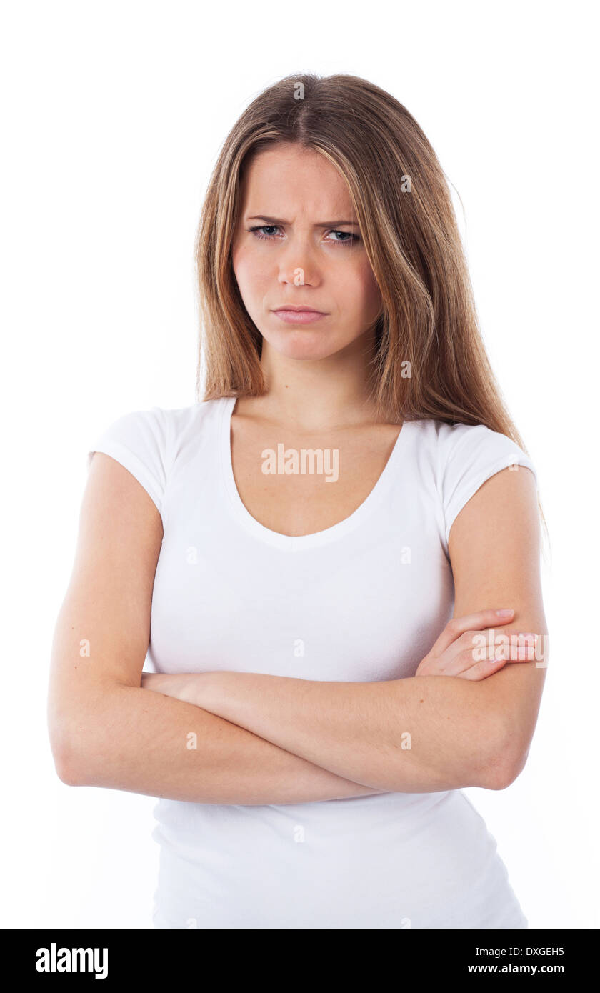 Ritratto di una donna infelice con le braccia incrociate, isolato su bianco Foto Stock