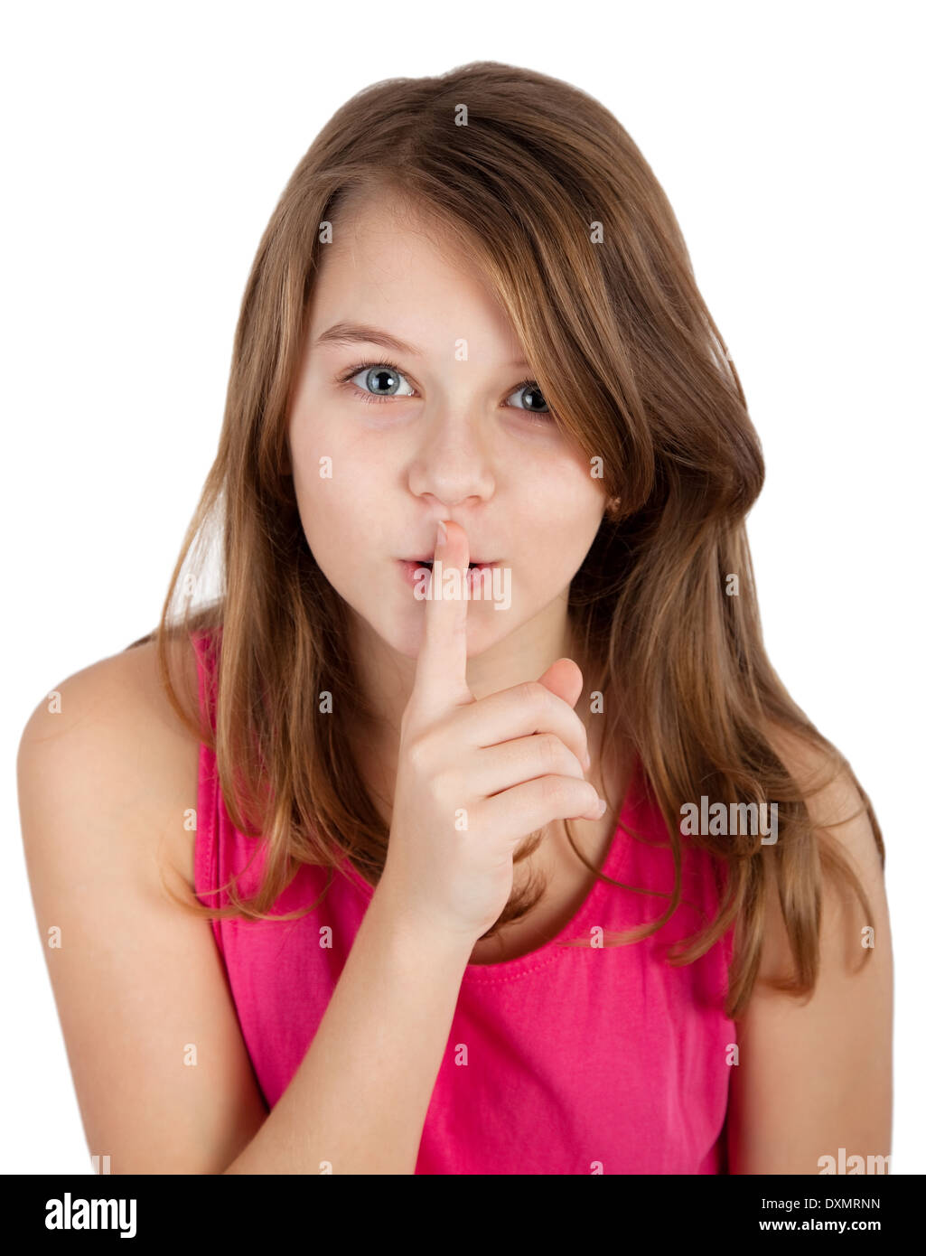 Ritratto di una giovane ragazza con il dito sulle labbra Foto Stock