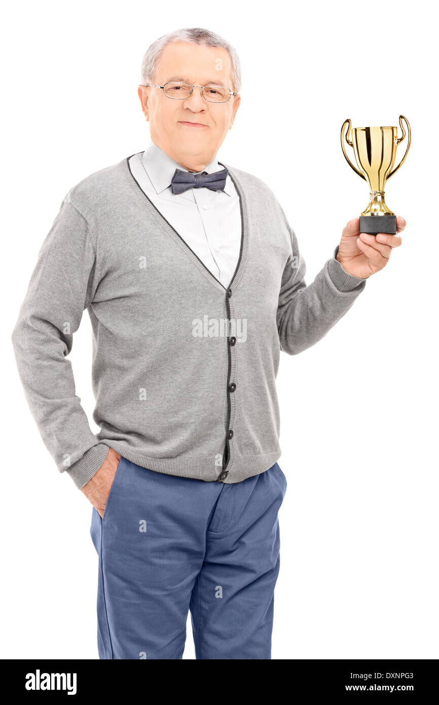 Uomo maturo tenendo un trofeo Foto Stock