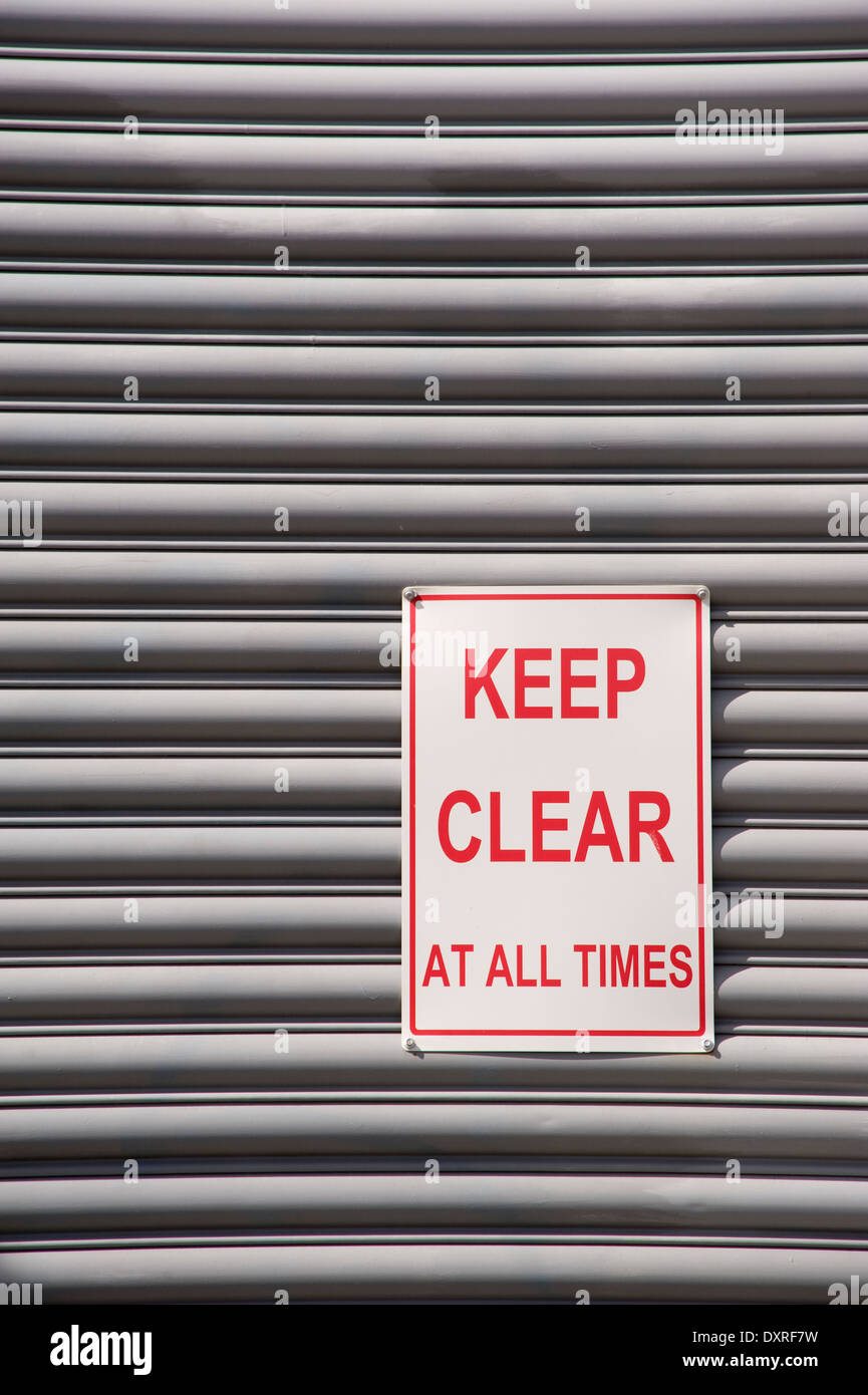 Mantenere chiaro segno sul rullo di sfondo della porta Foto Stock