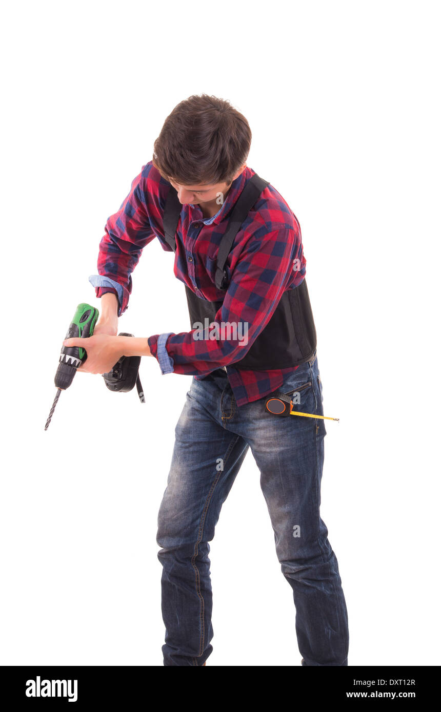 Uomo con trapano elettrico su uno sfondo bianco, tuttofare Foto Stock