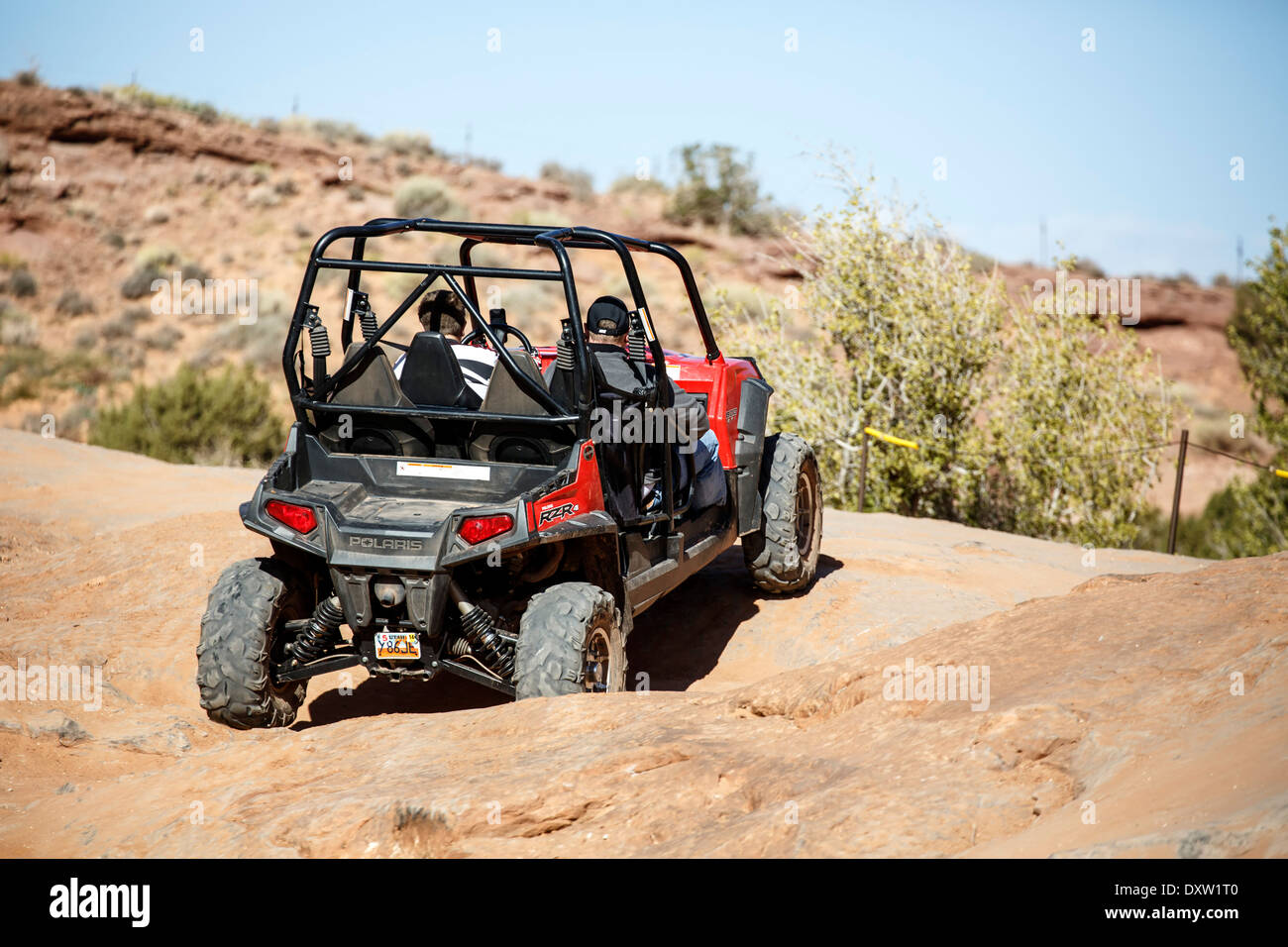 ATV su Hell's Revenge Trail, sabbia Appartamenti Area ricreativa, Moab, USA Utah Foto Stock