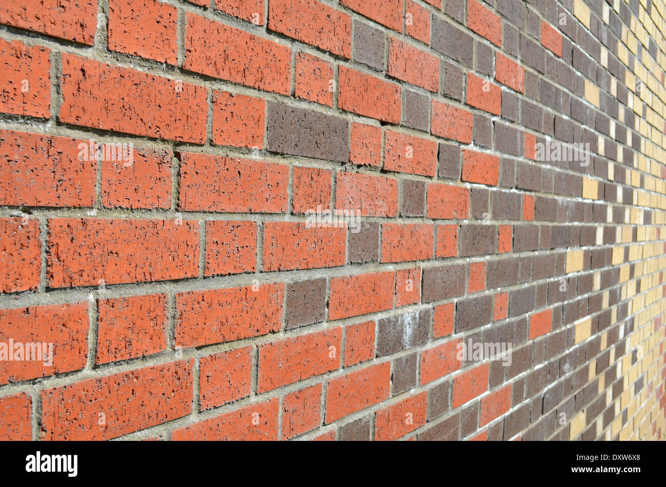 Un muro di mattoni, con multi colore modello di mattoni Foto Stock