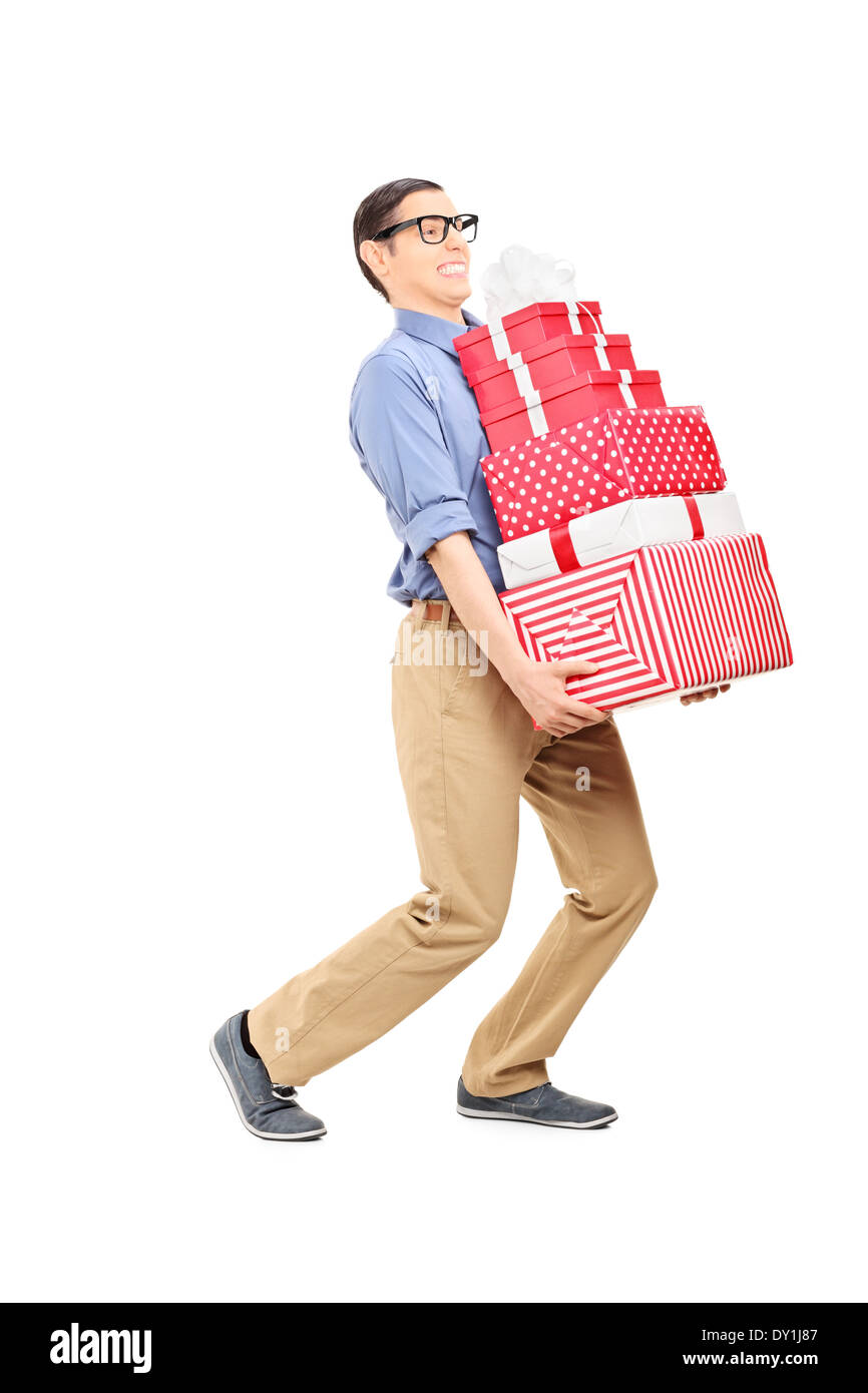 L'uomo trasporta un carico pesante di regali Foto Stock