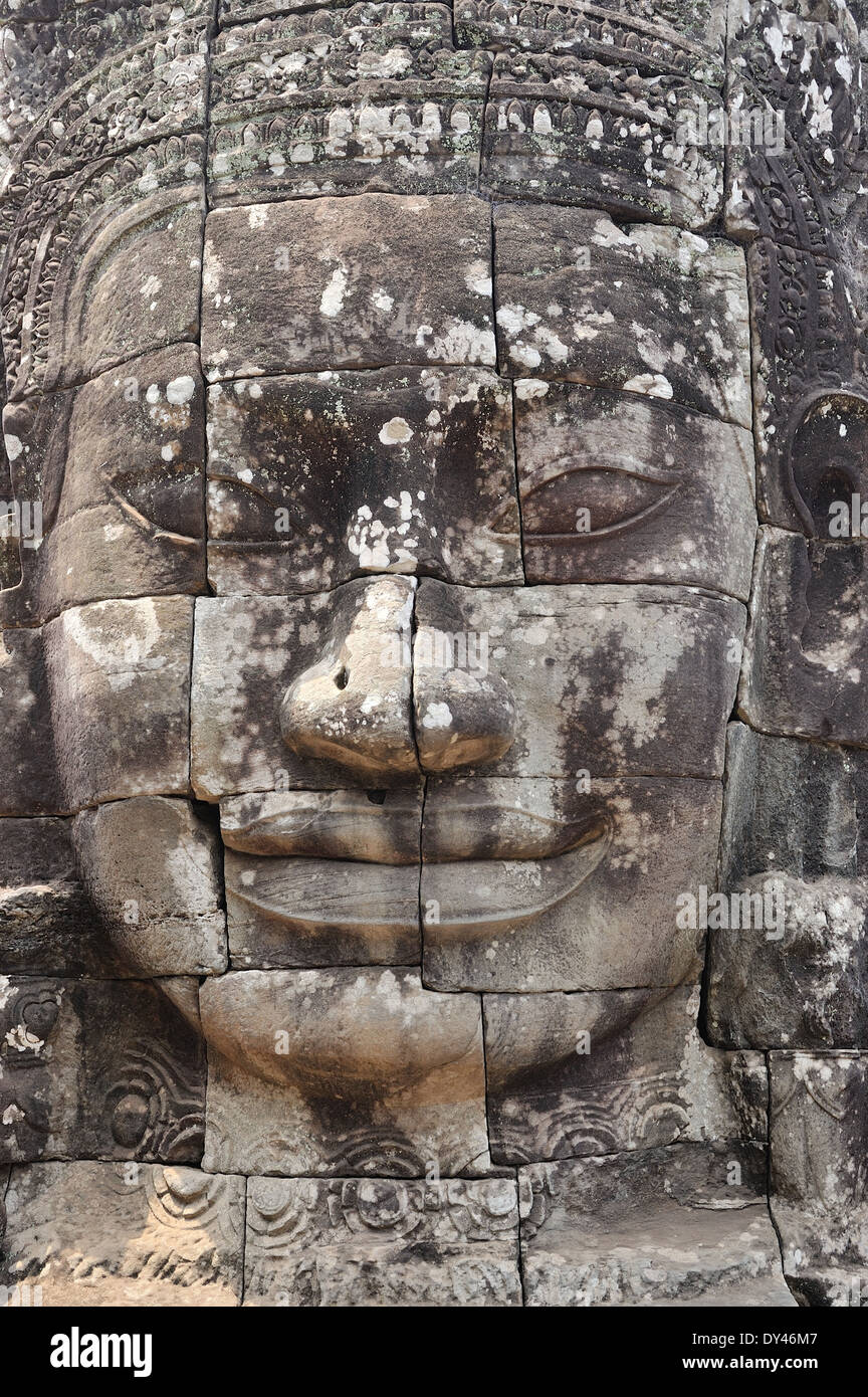 Dettaglio della pietra volto scolpito il tempio Bayon Angkor Thom Cambogia Foto Stock