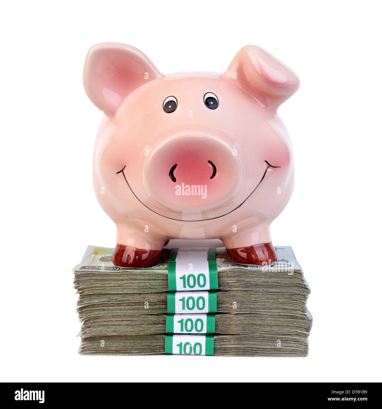 Salvadanaio in piedi su una pila di banconote Foto Stock