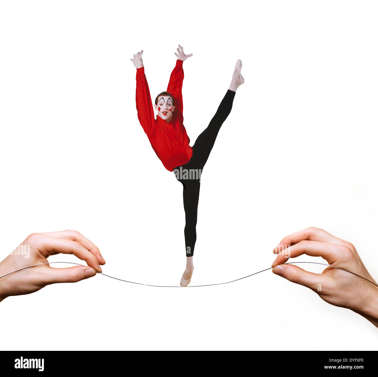 Arlecchino equilibratura su highwire tightrope Foto Stock