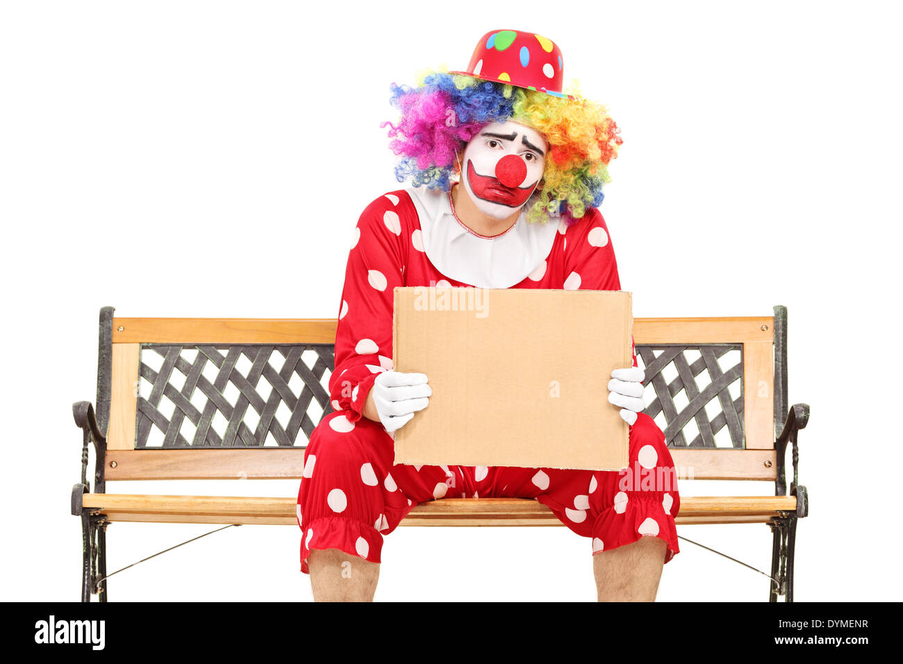 Triste clown tenendo un vuoto segno di cartone Foto Stock