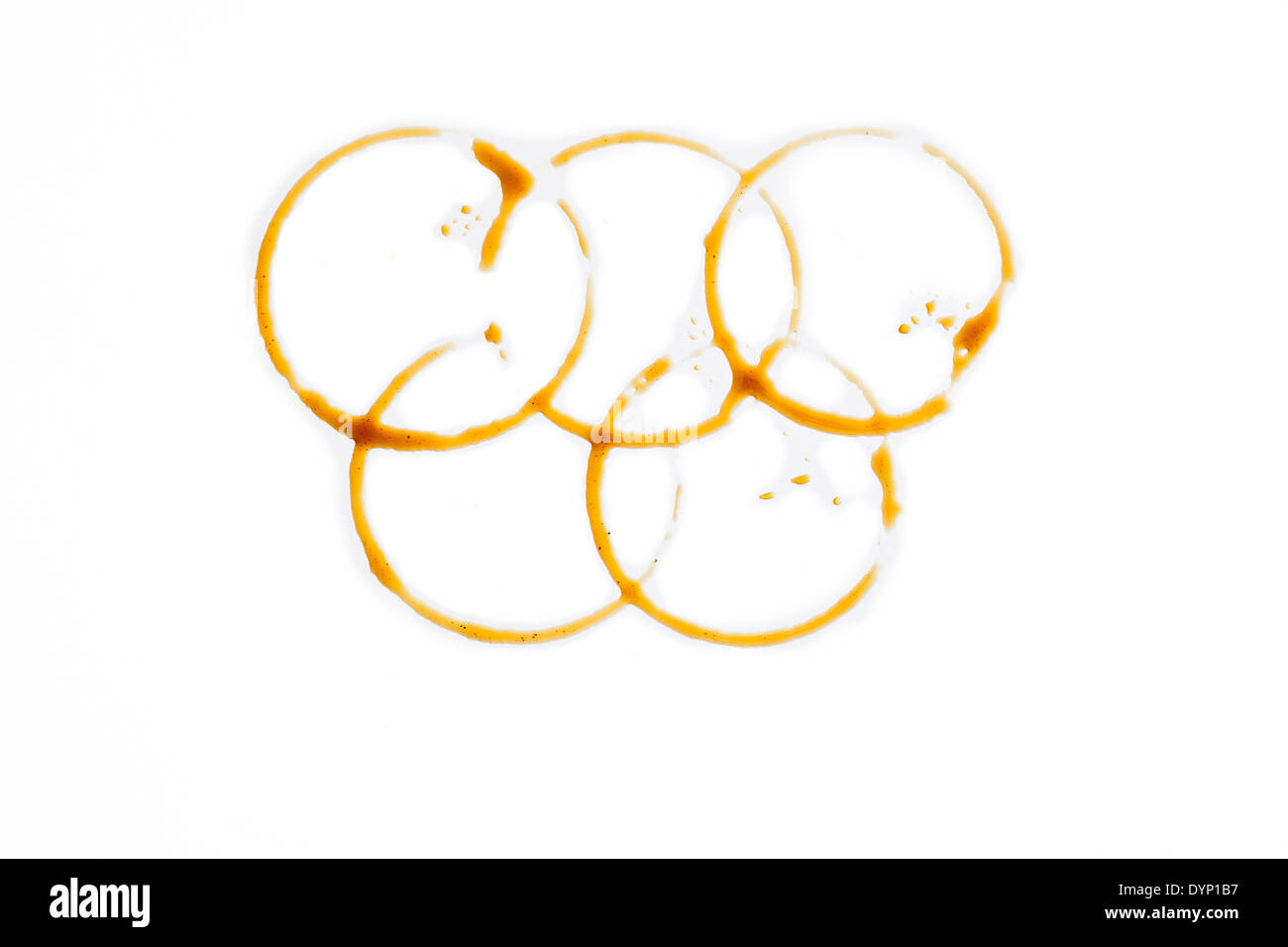 Anelli olimpici fatta di gocce di caffè Foto Stock
