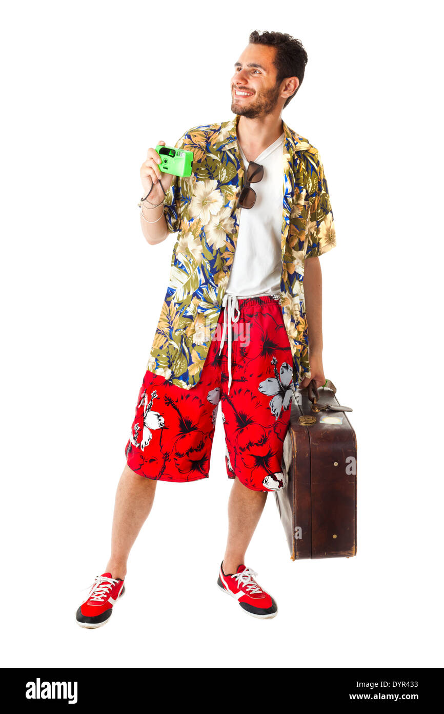 Un giovane maschio attraente in un colorato vestito pronto a viaggiare come uno stereotipo tourist Foto Stock