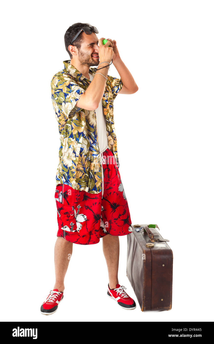 Un giovane maschio attraente in un colorato vestito pronto a viaggiare come uno stereotipo tourist Foto Stock