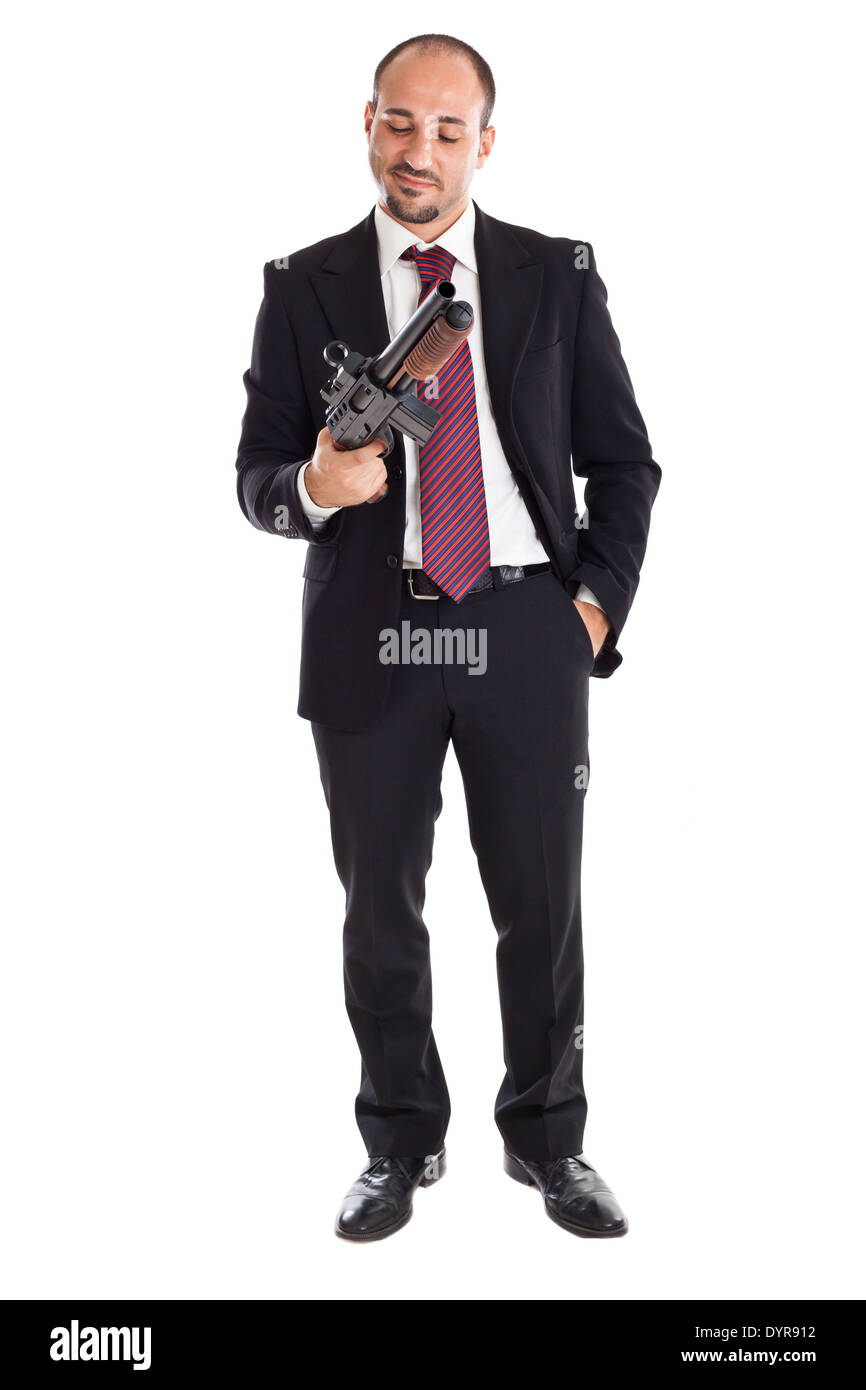 Un imprenditore e permanente tenendo un fucile a canna liscia Foto Stock