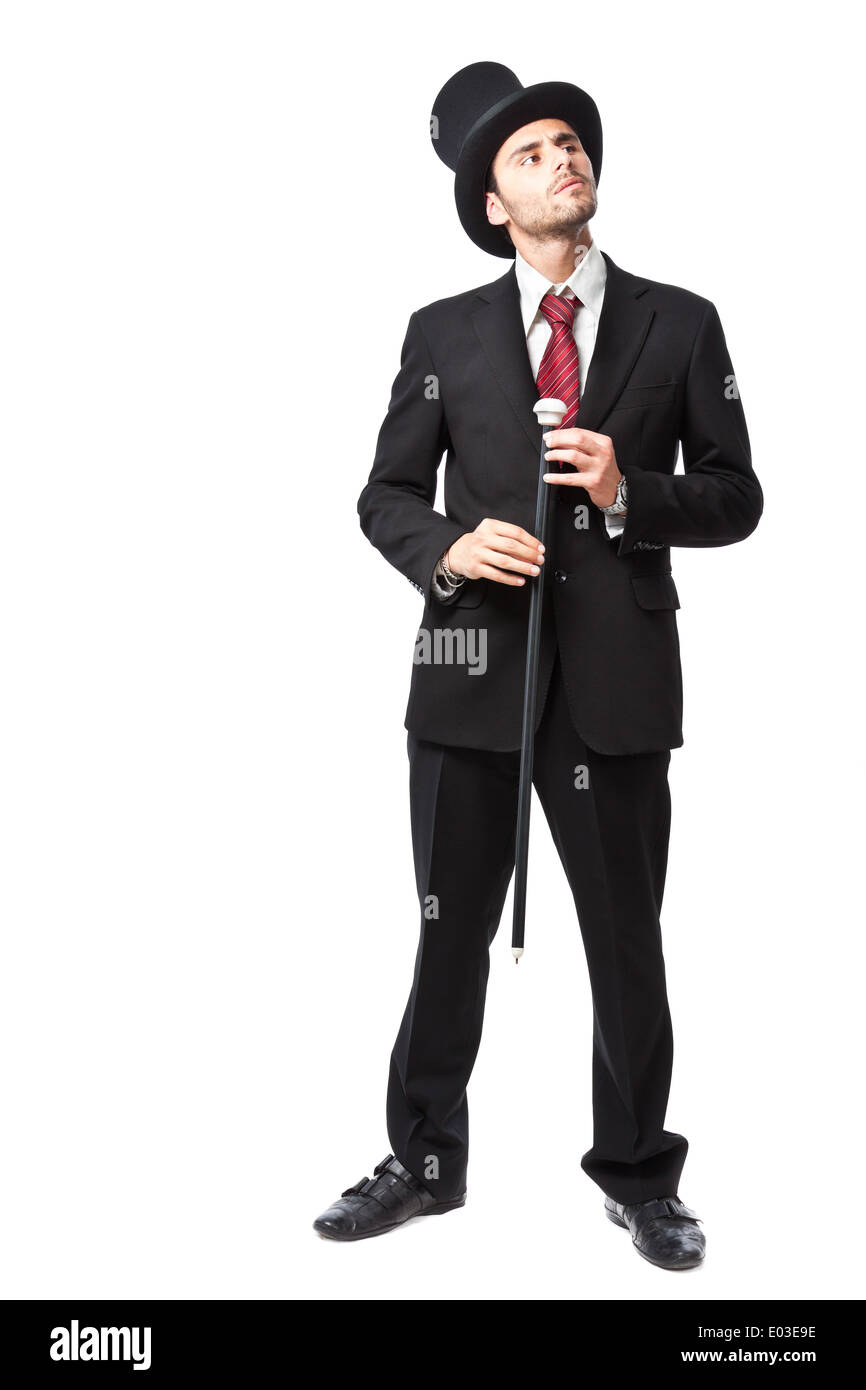 Imprenditore con Top Hat e bastone in una suite Foto Stock