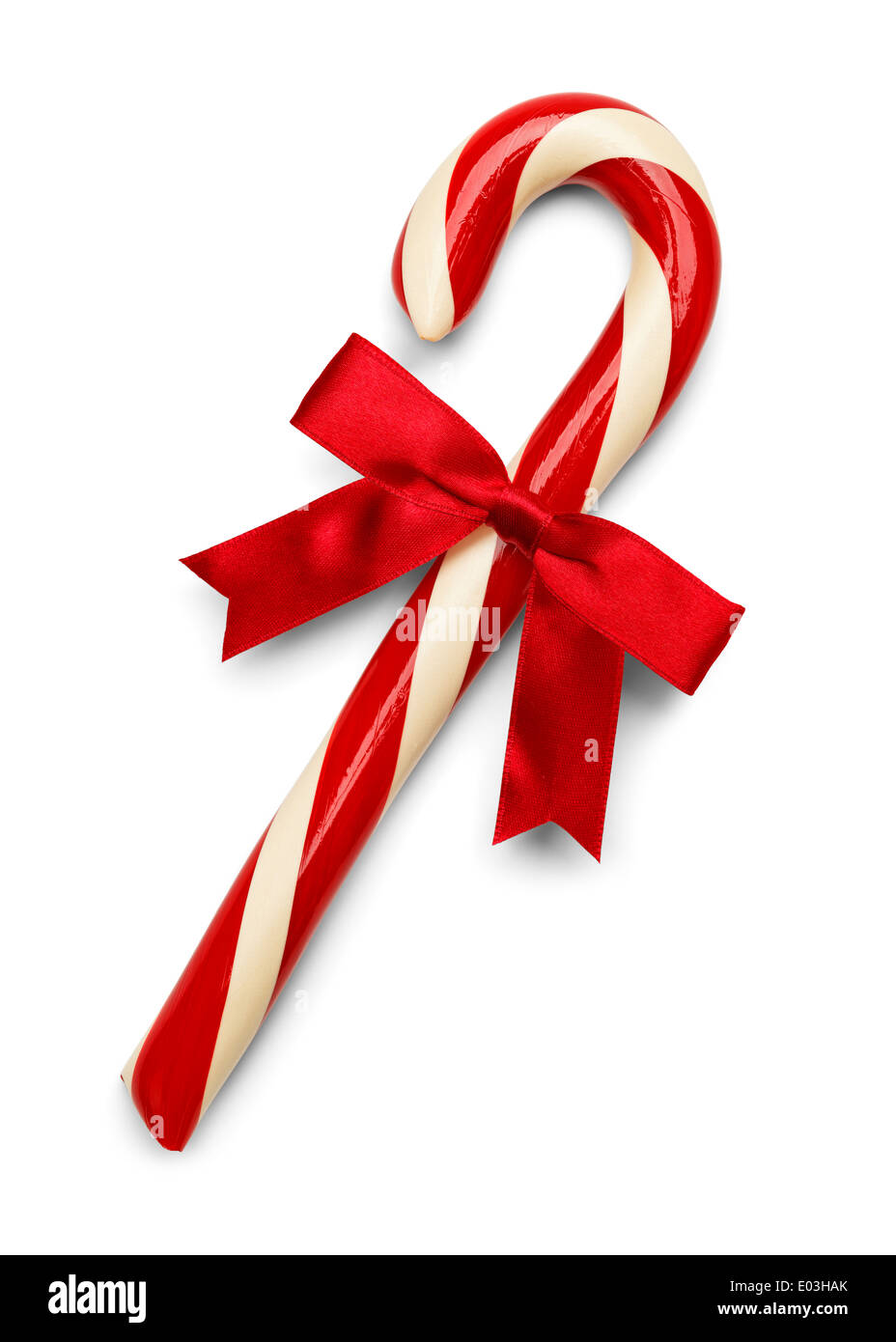 Natale Candy Cane con fiocco rosso isolato su sfondo bianco. Foto Stock